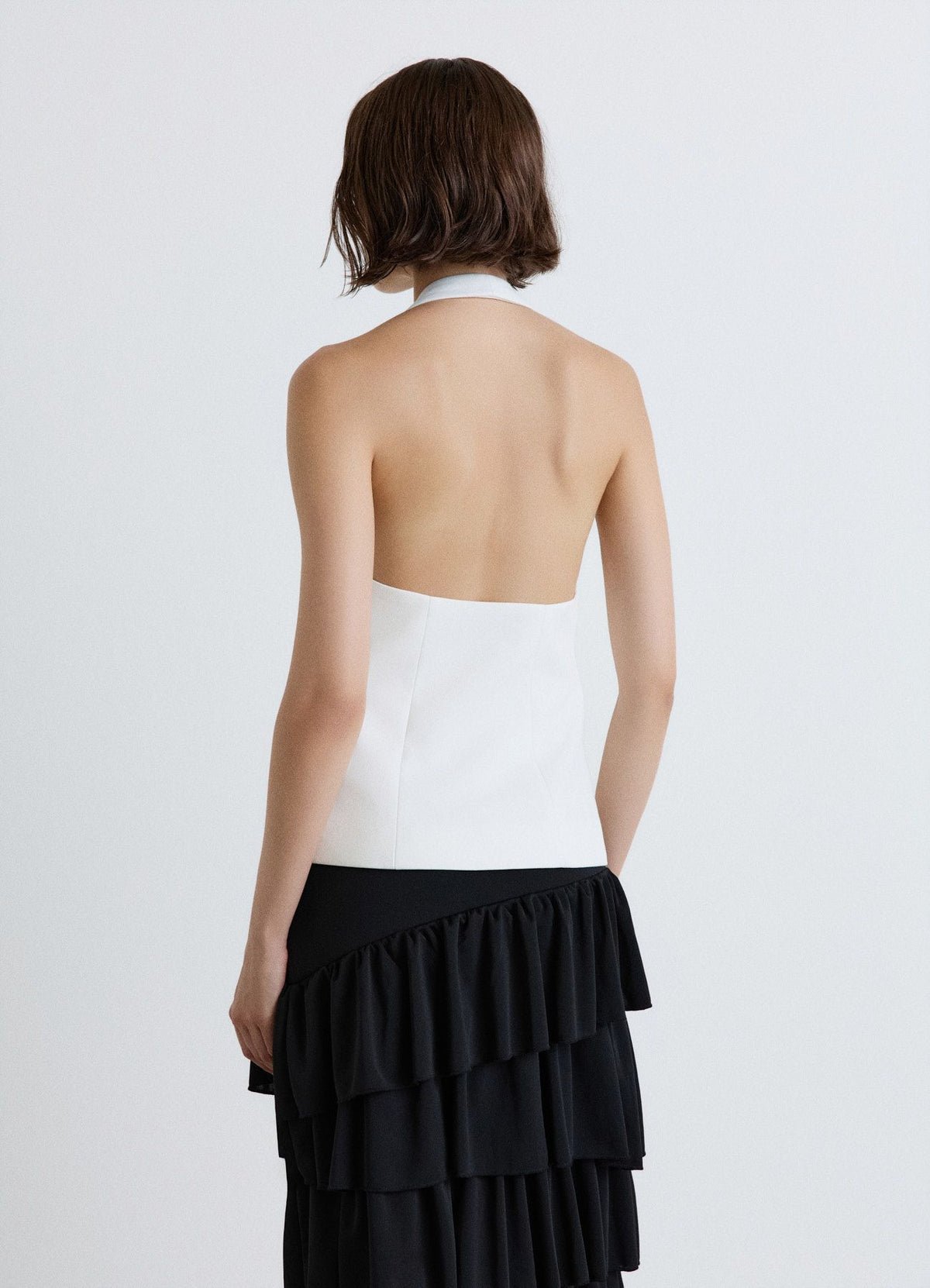 Gilet dos nu col licou à bouton bijou