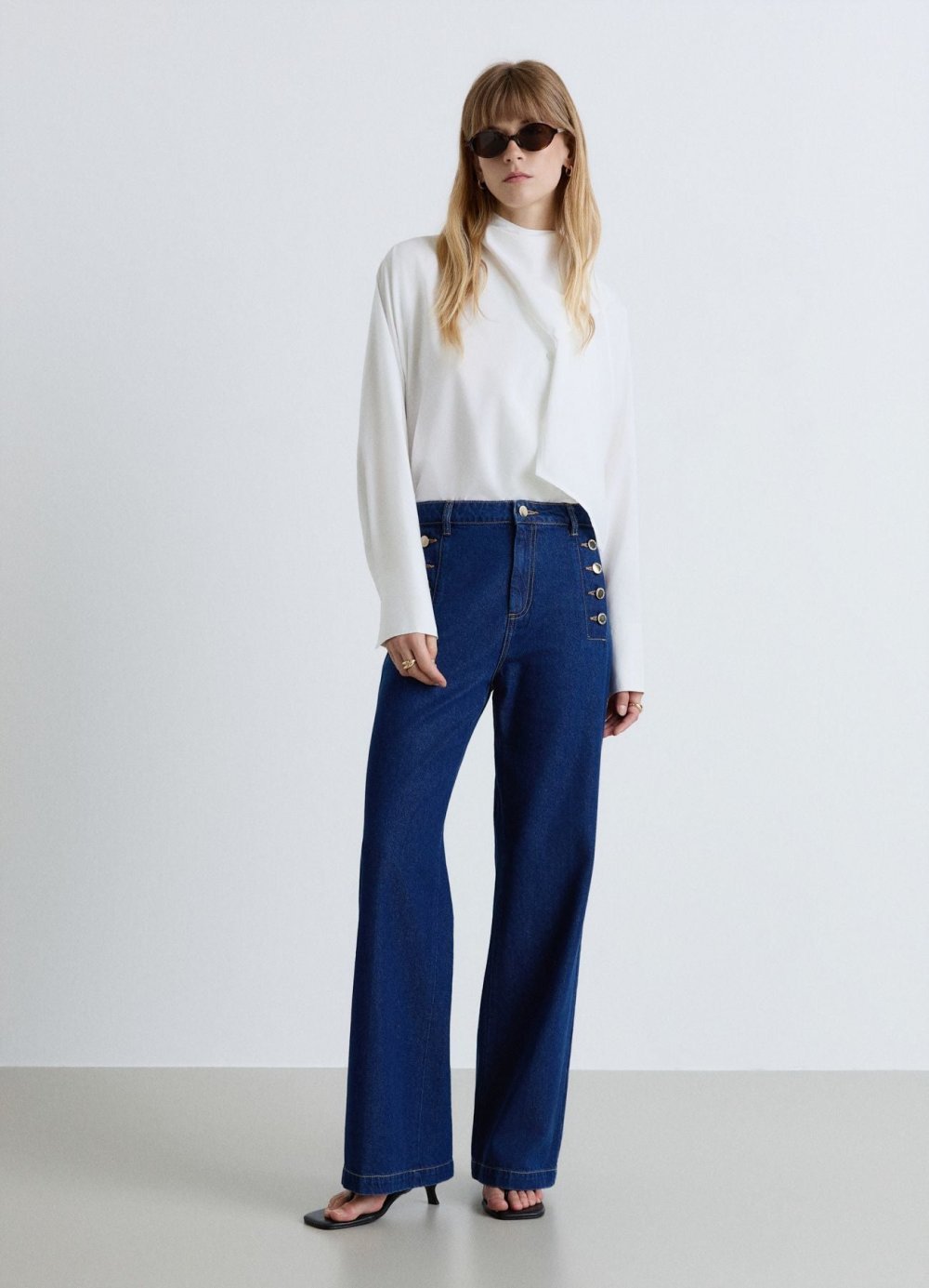 High-waisted palazzo jeans with button details