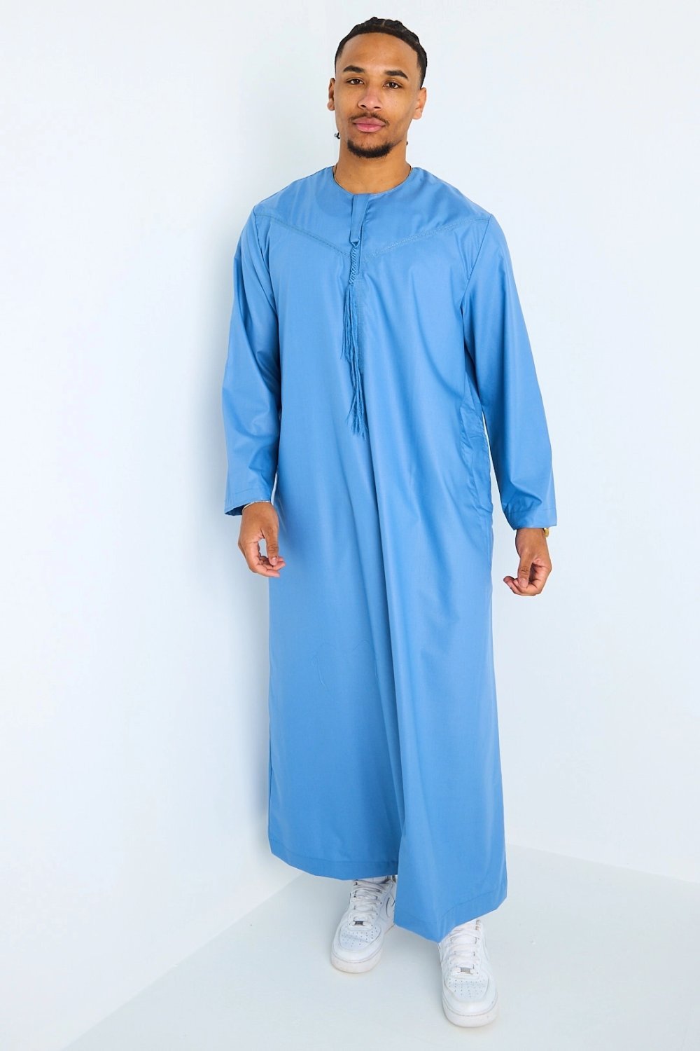 Long blue high-neck qamis with tassels