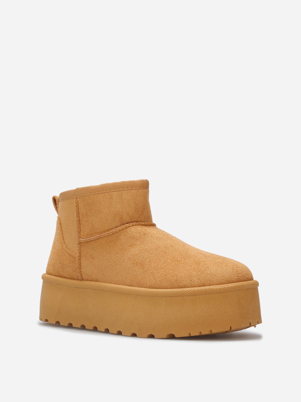 Boots basses fourrées à surpiqûres camel