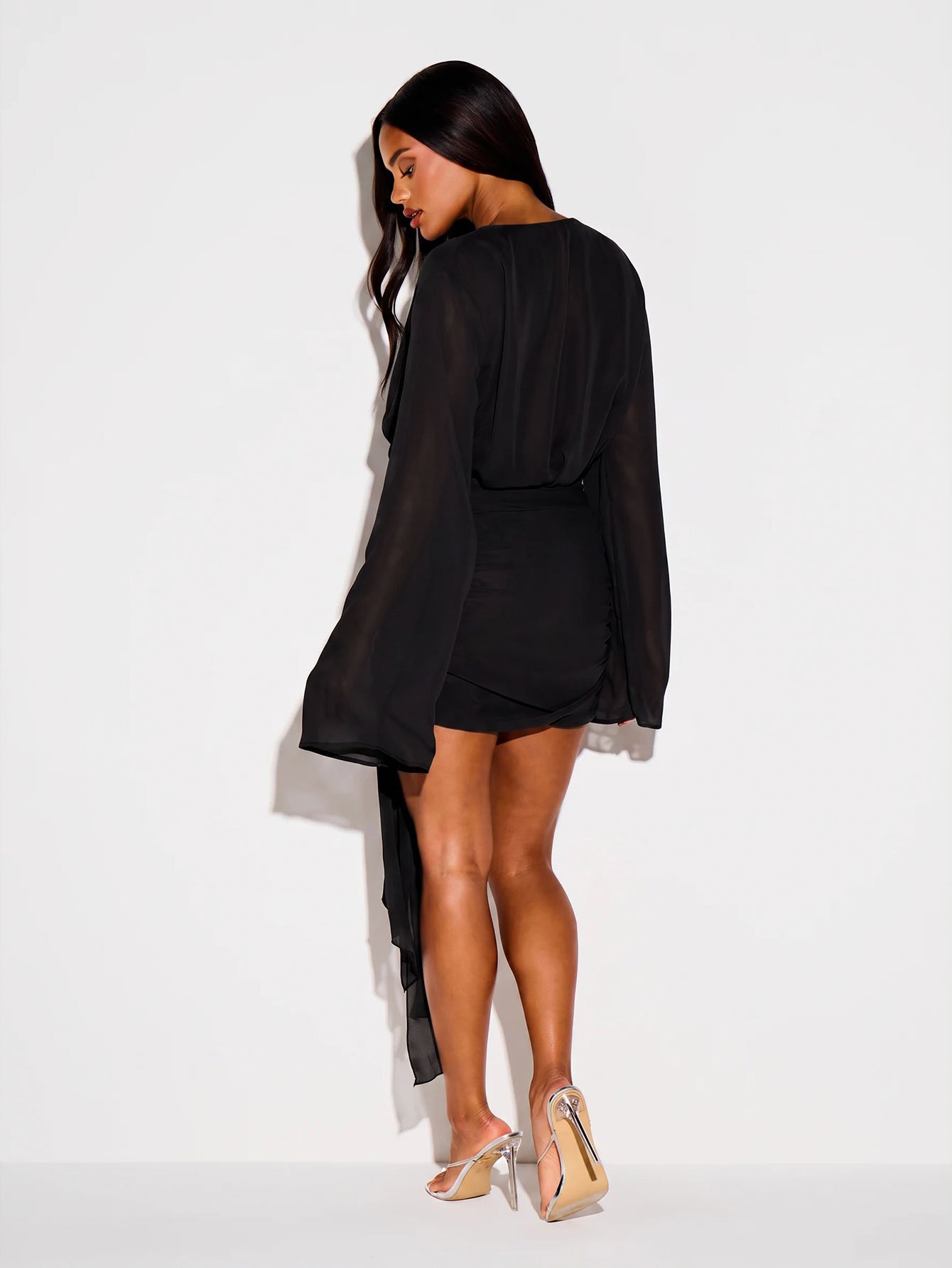 Plunge V-neck mini dress with cape sleeves and bow