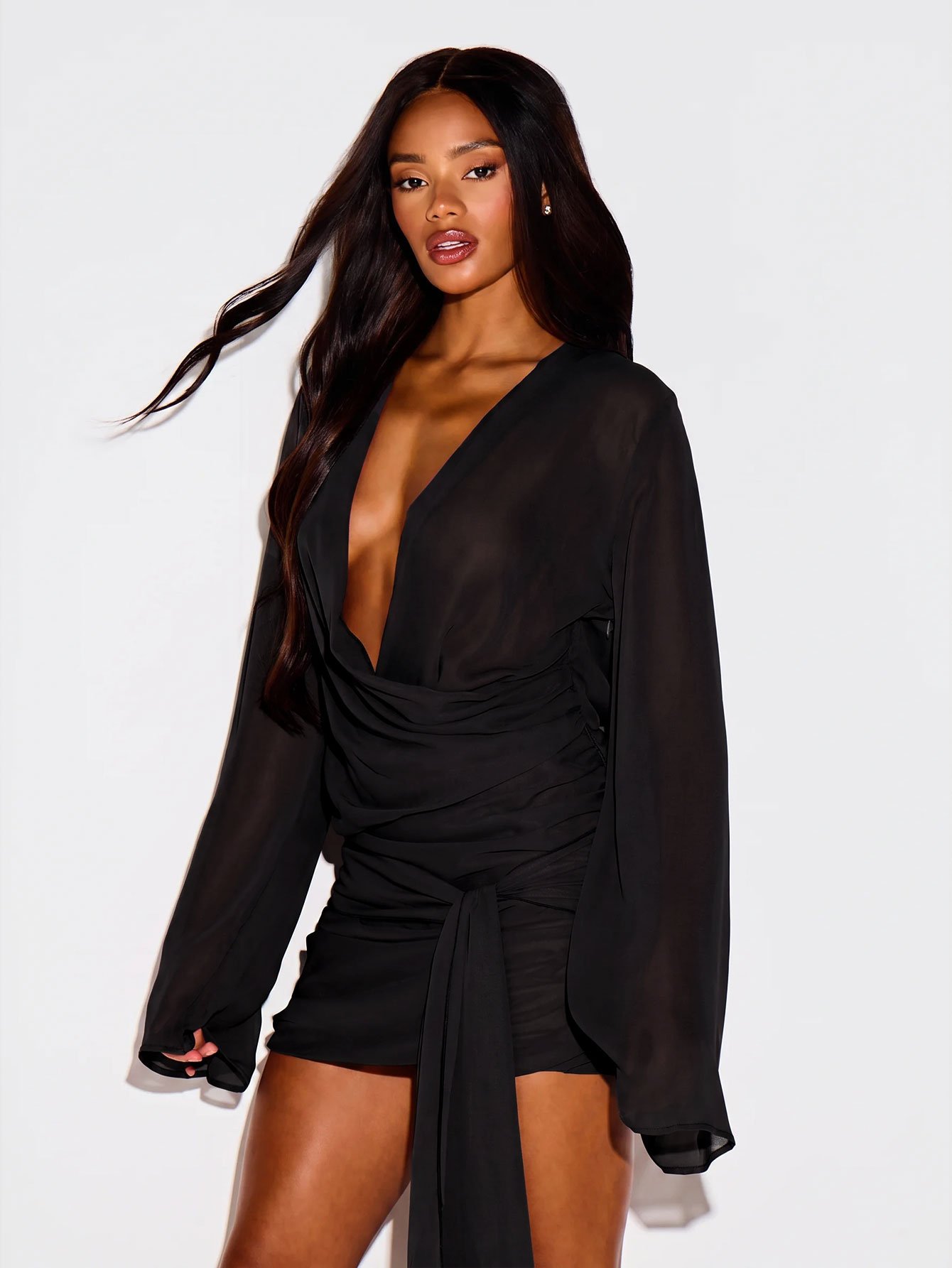 Plunge V-neck mini dress with cape sleeves and bow
