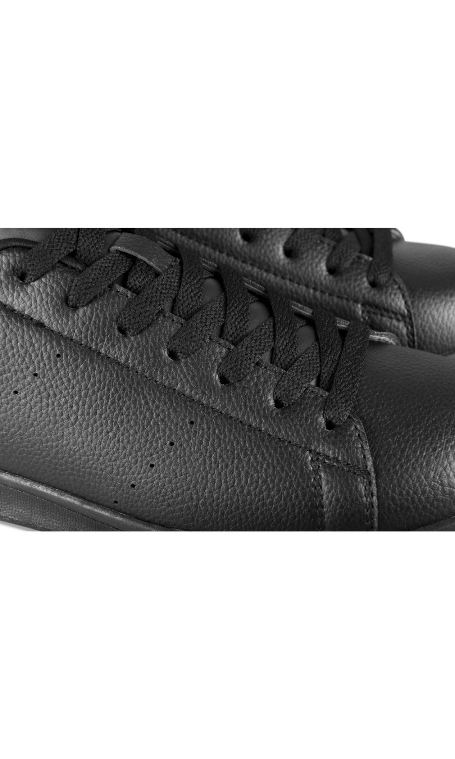 Black perforated low-top trainers