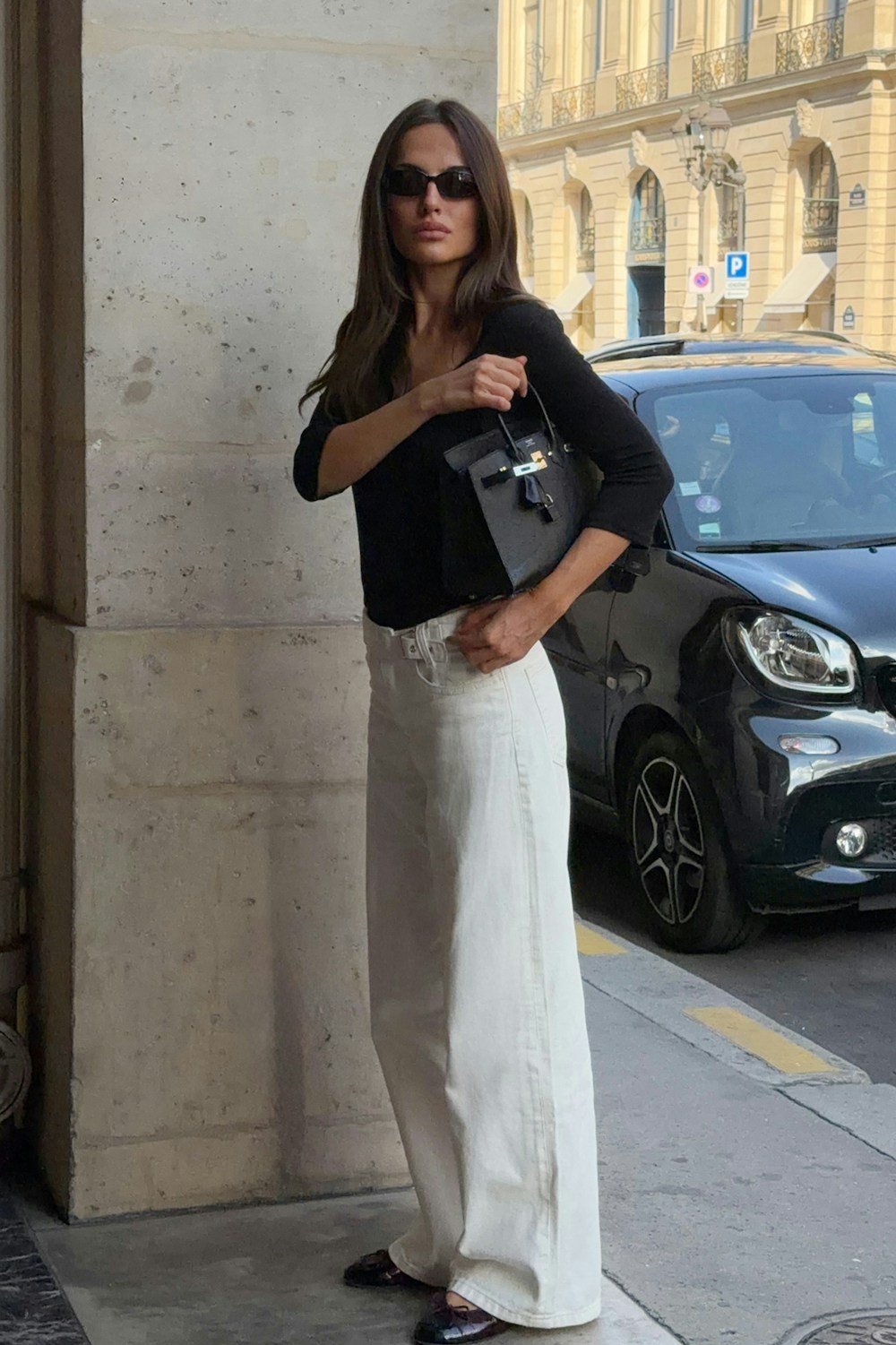 White mid-rise baggy jeans with buckle detail