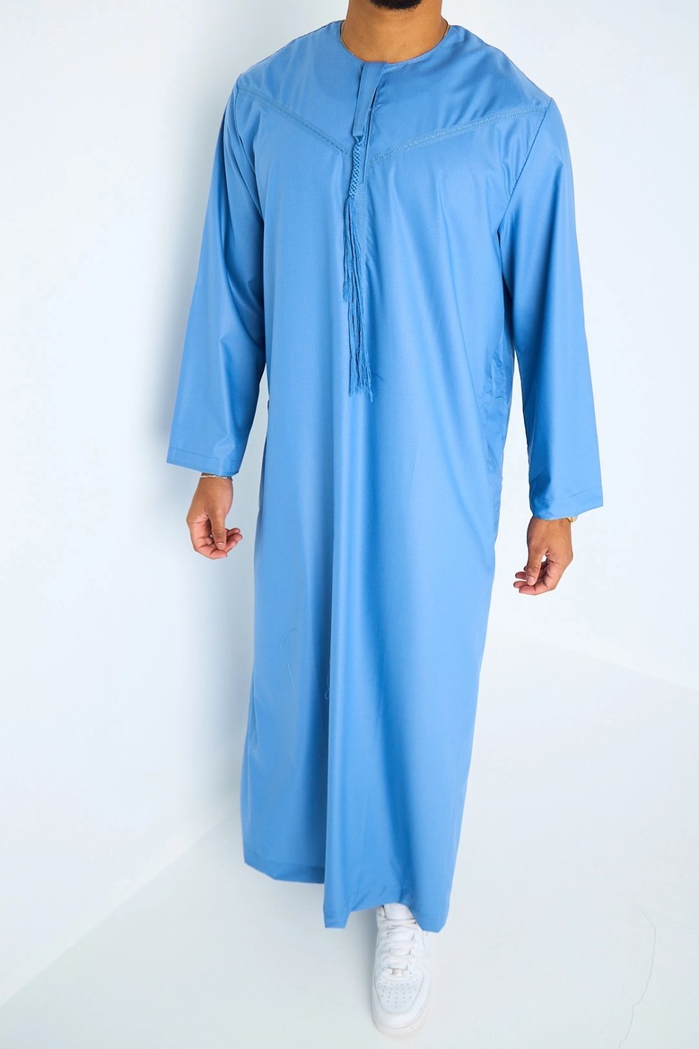 Long blue high-neck qamis with tassels