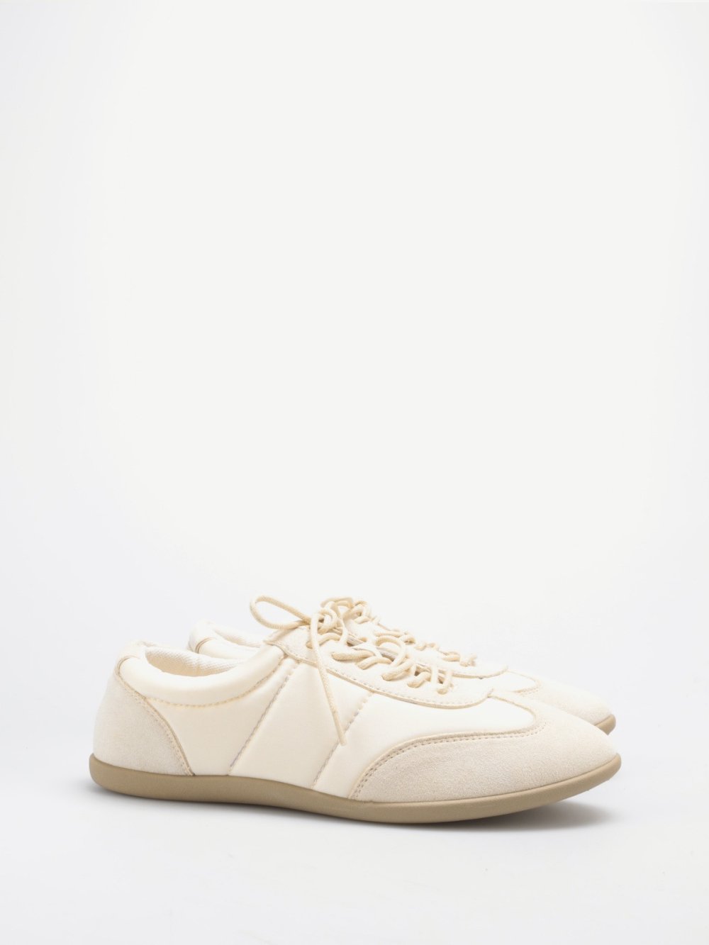 Beige quilted and faux suede trainers