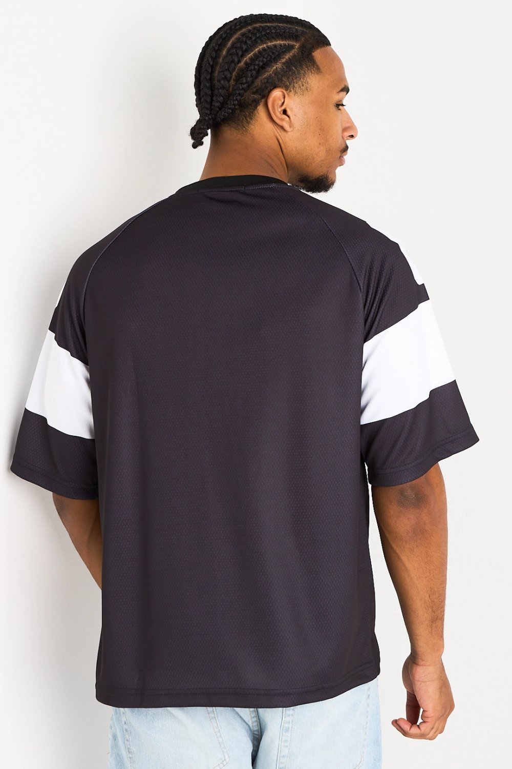 Black V-neck tee with face print
