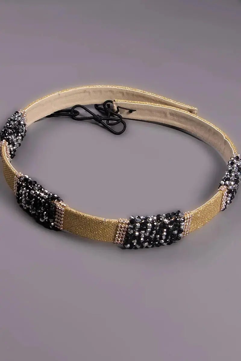 Fine gold belt braided with black beads