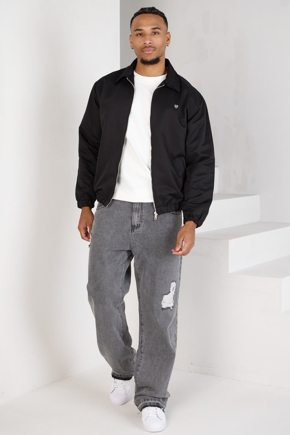 Black zip-up jacket with chest heart