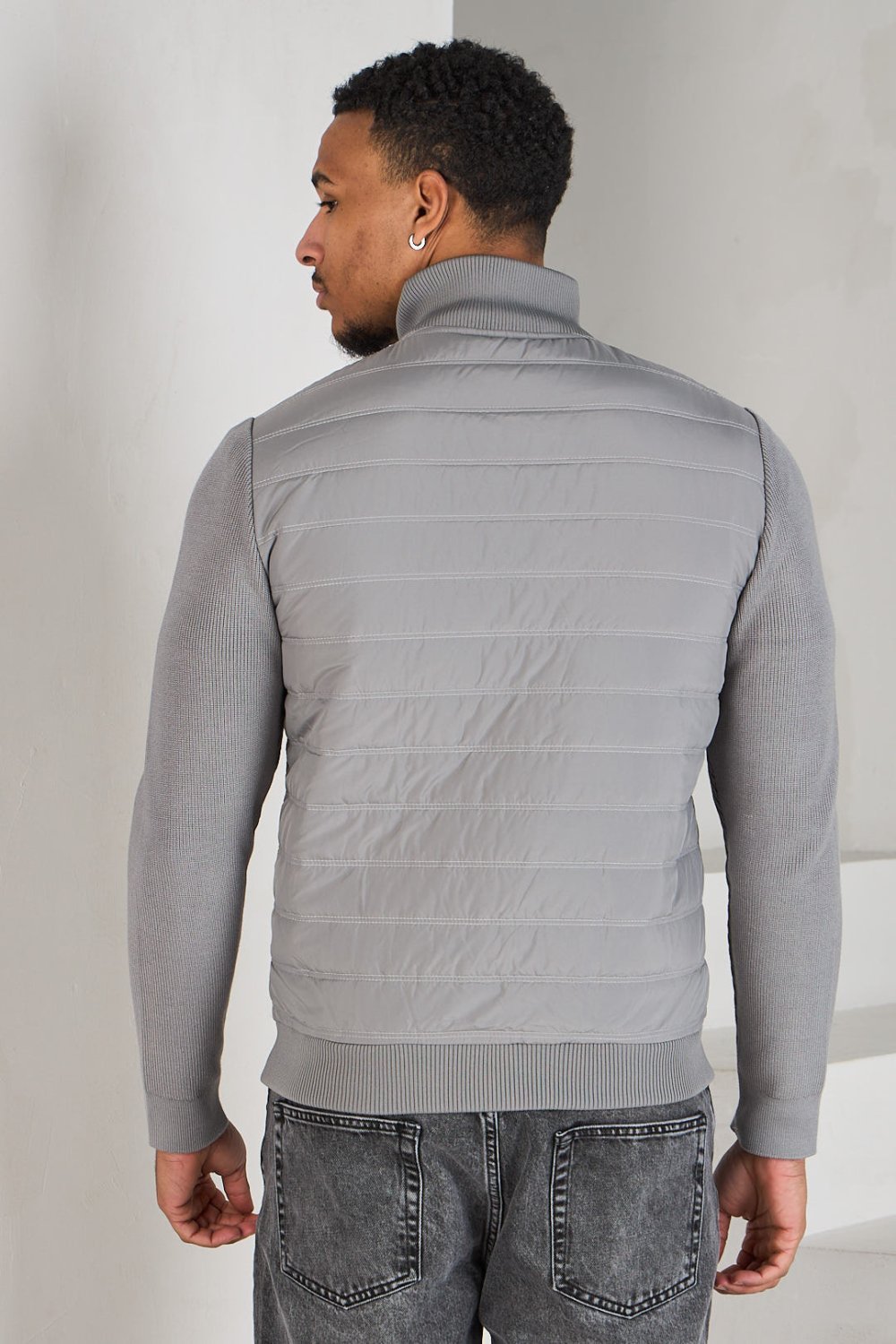 Dark grey quilted jacket with knit panel