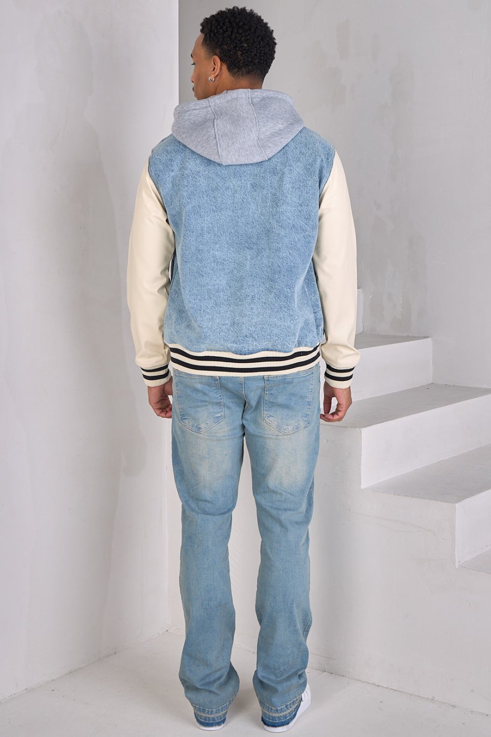 Blue denim jacket with faux leather sleeves