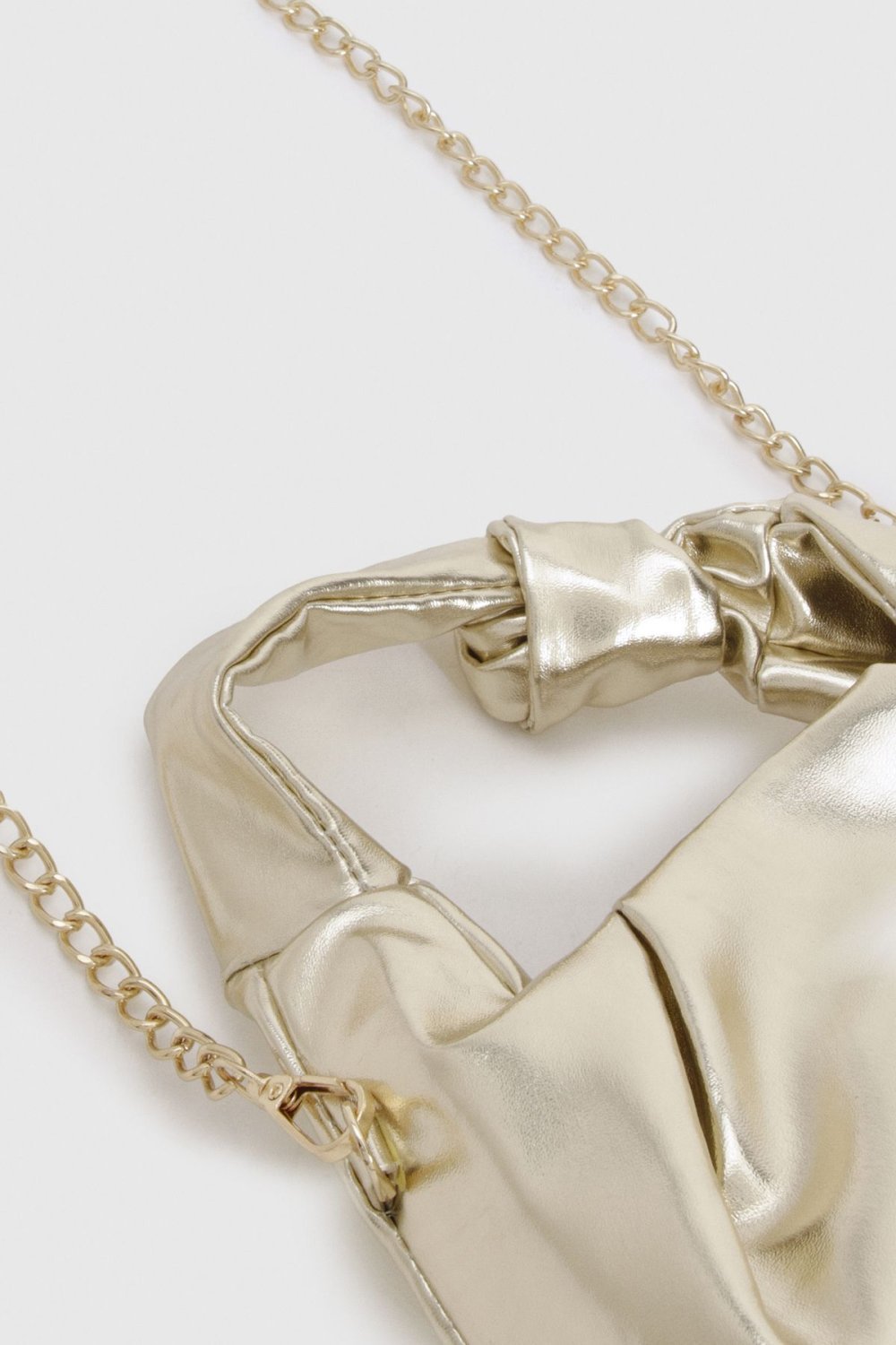 Metallic grab bag with knot handle