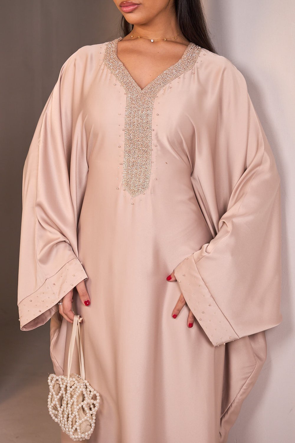 Beige satin abaya with beaded V-neck