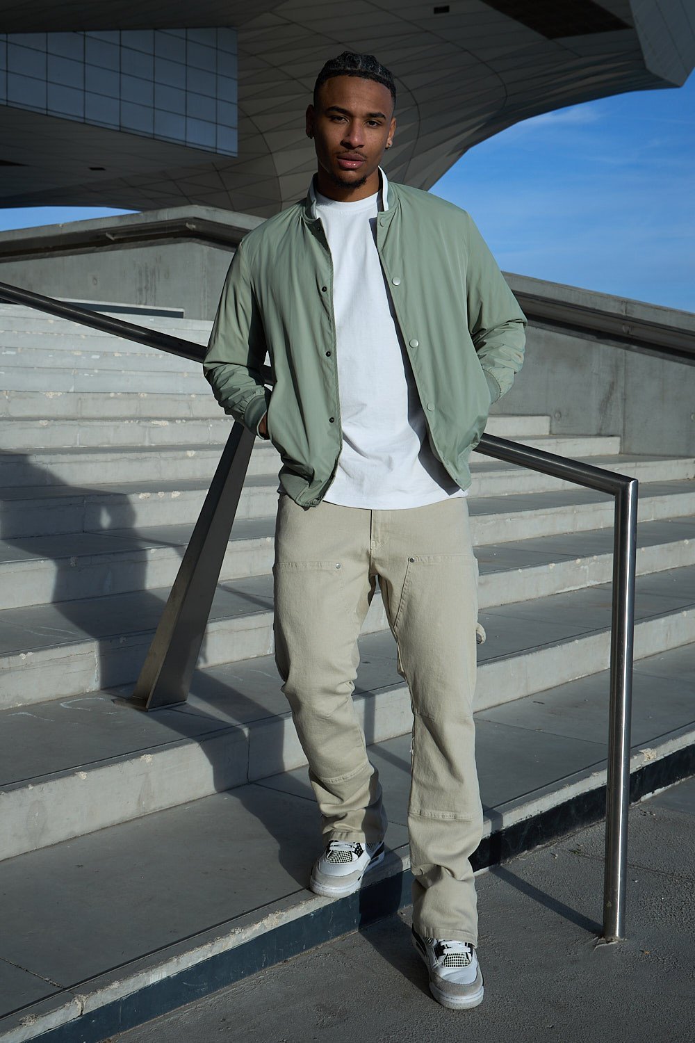 Green bomber jacket with high collar