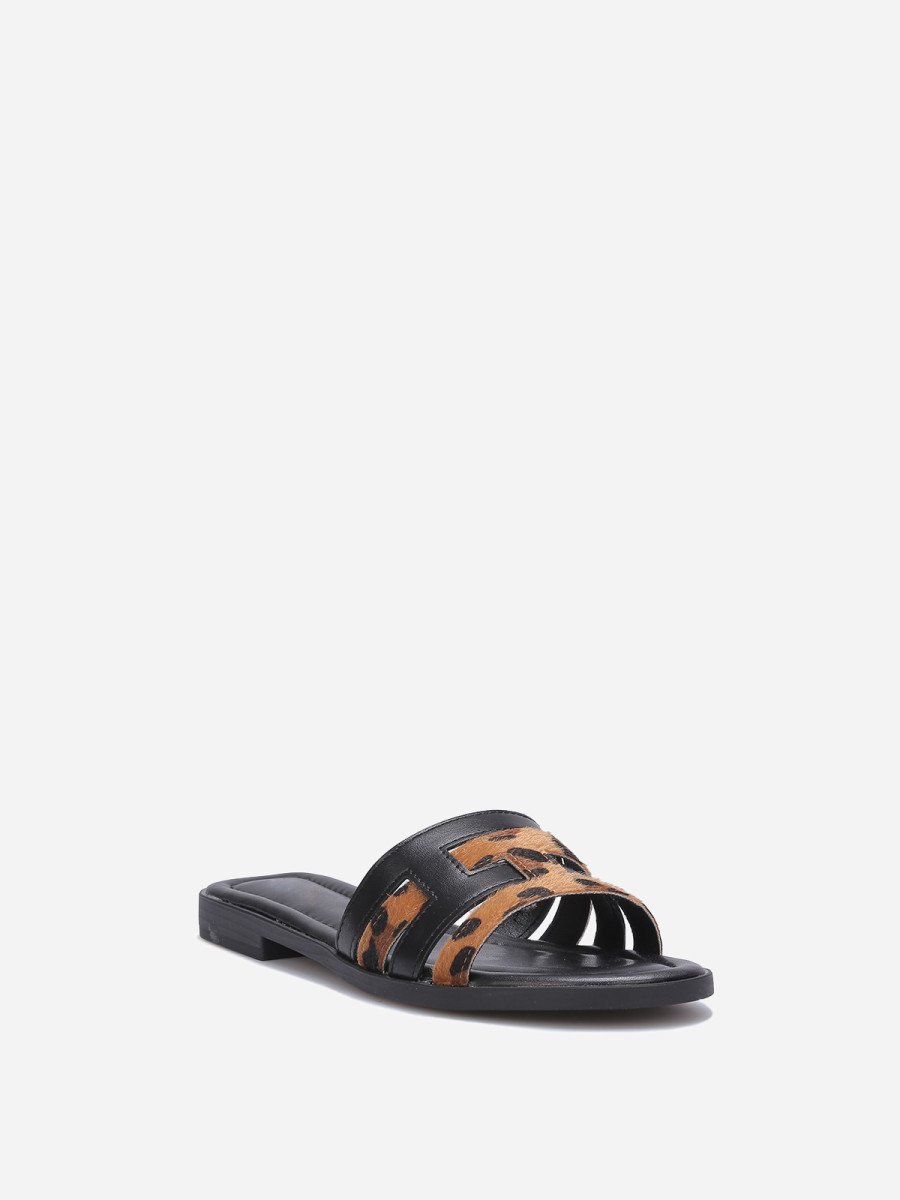 Black flat mules with interlocking straps