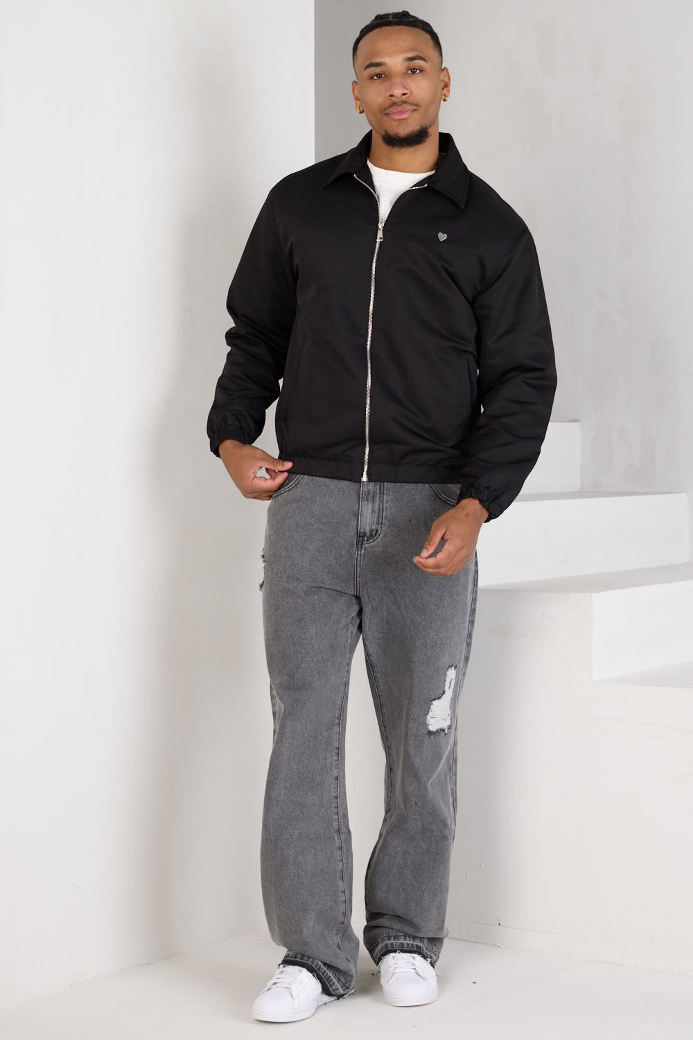 Black zip-up jacket with chest heart