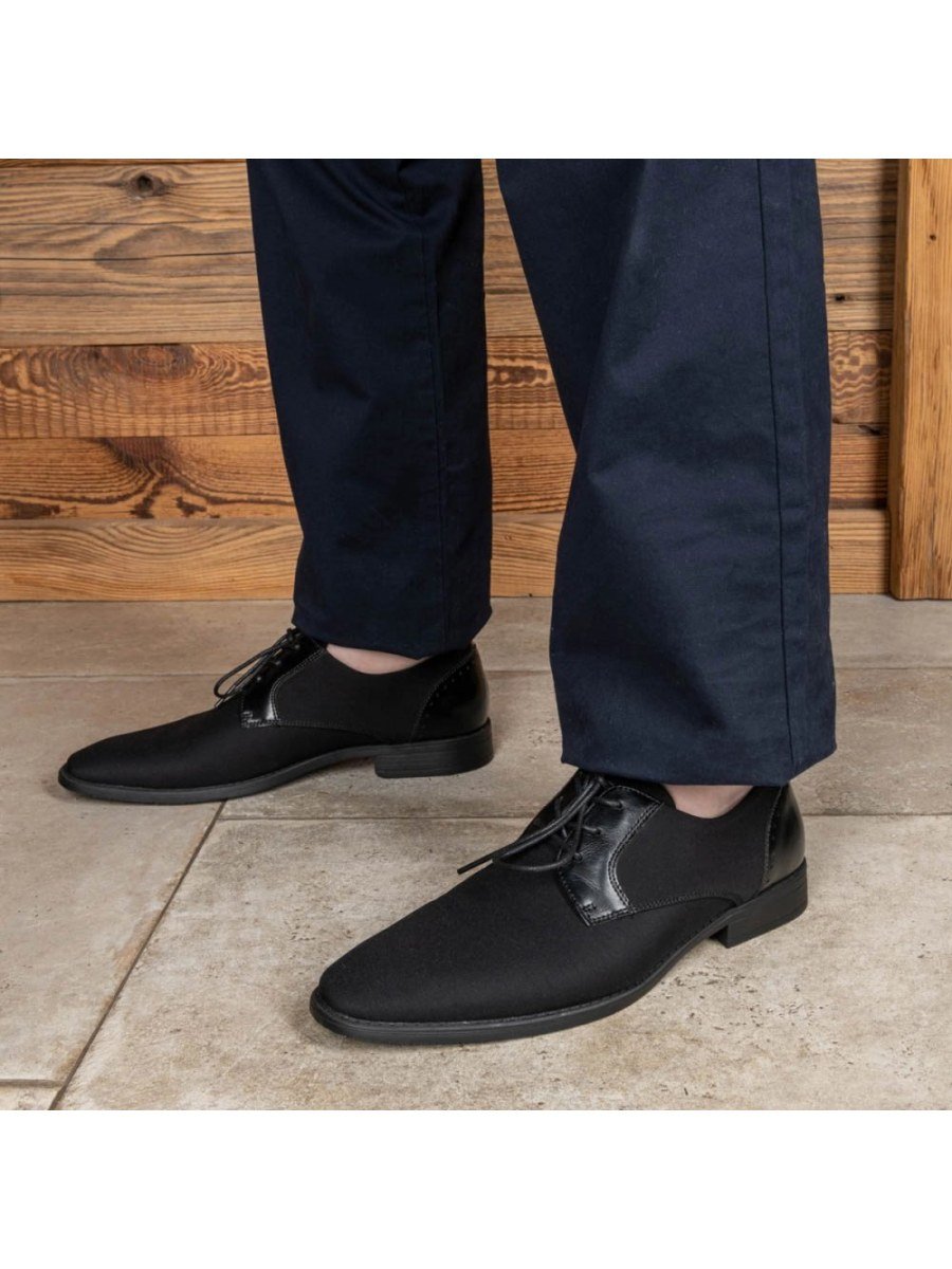 Black mixed-material derbies, brogued heel