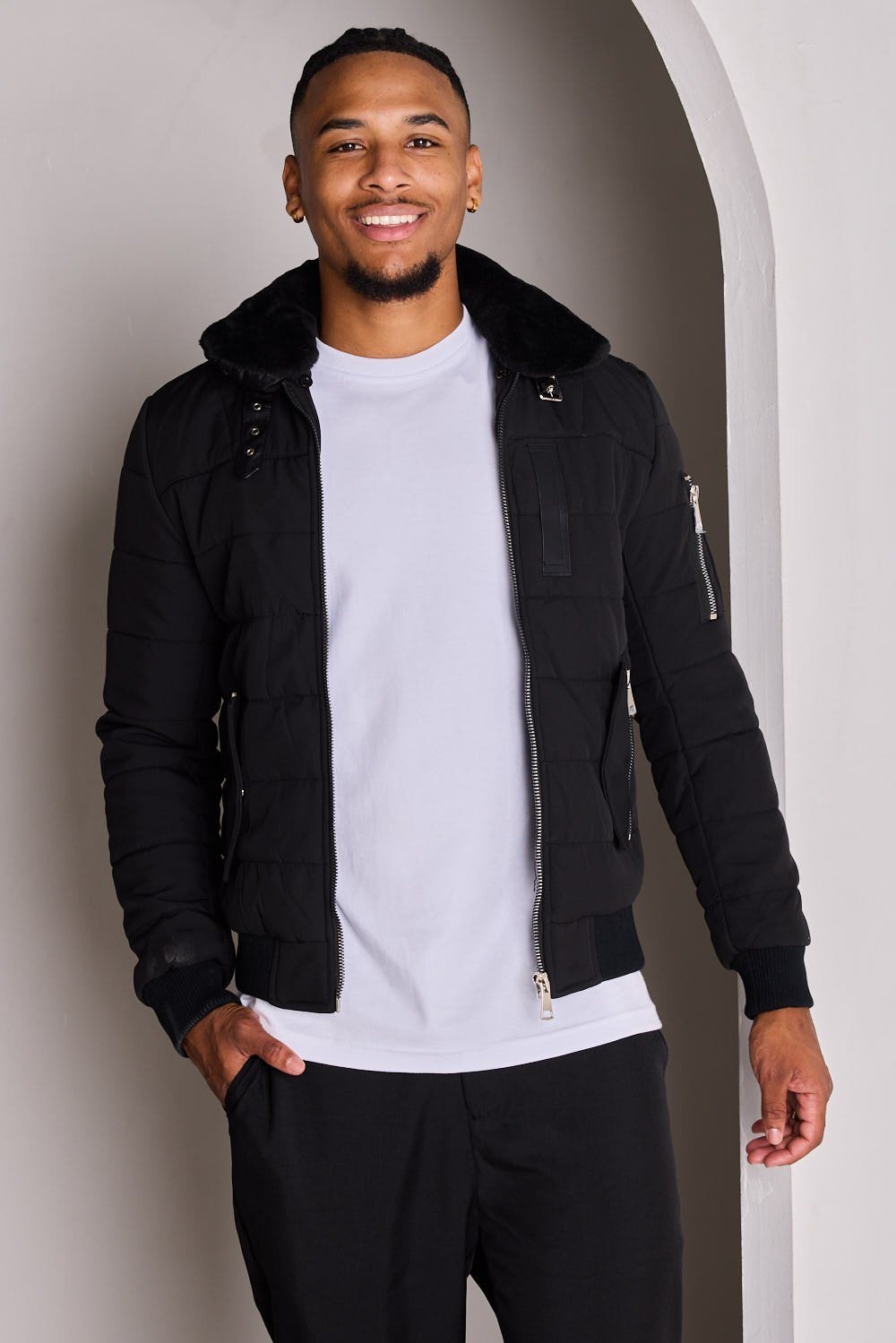Black quilted jacket with fur collar