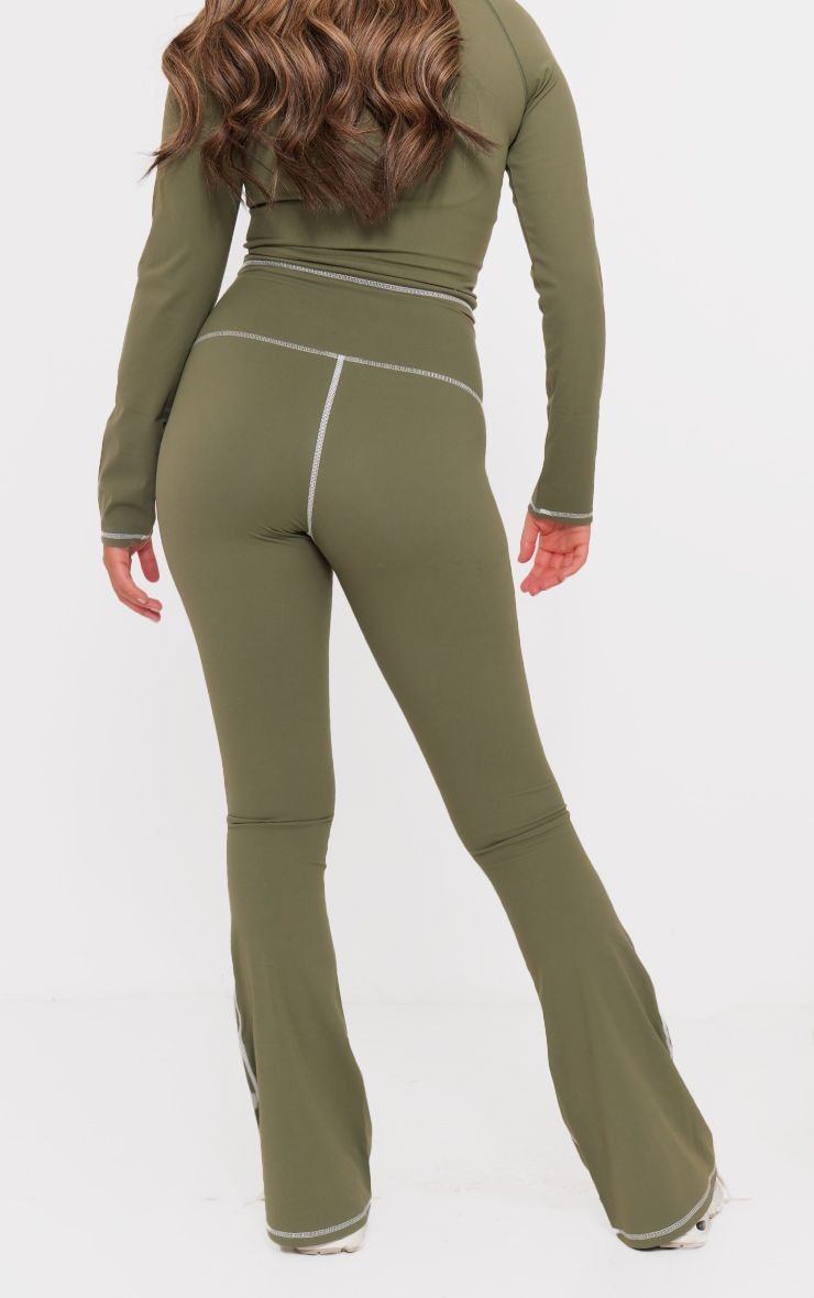 Shaping flared trousers with contrast trim