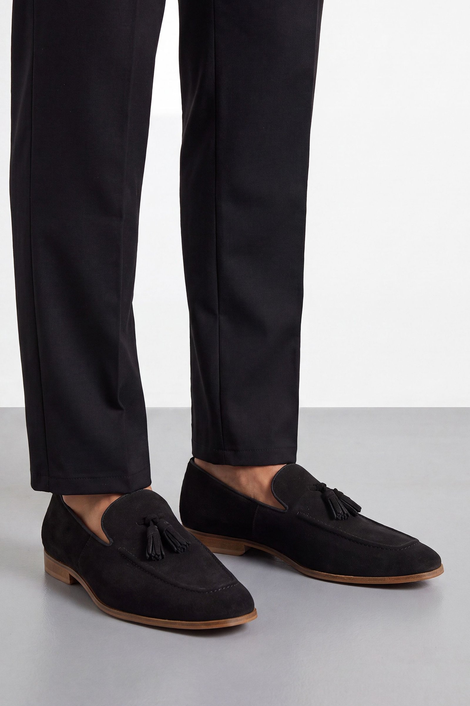 Mocassin à pompons en daim noir