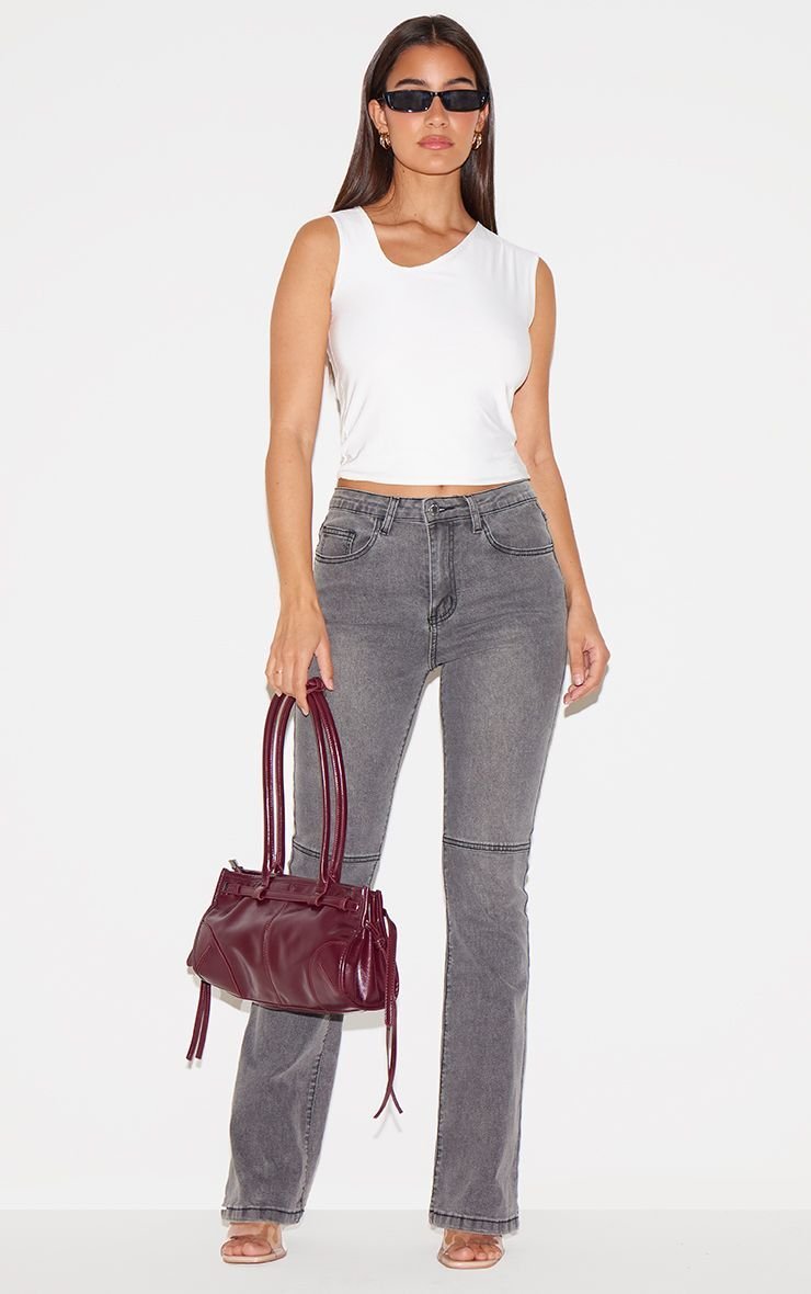 Grey flared jeans with seam details