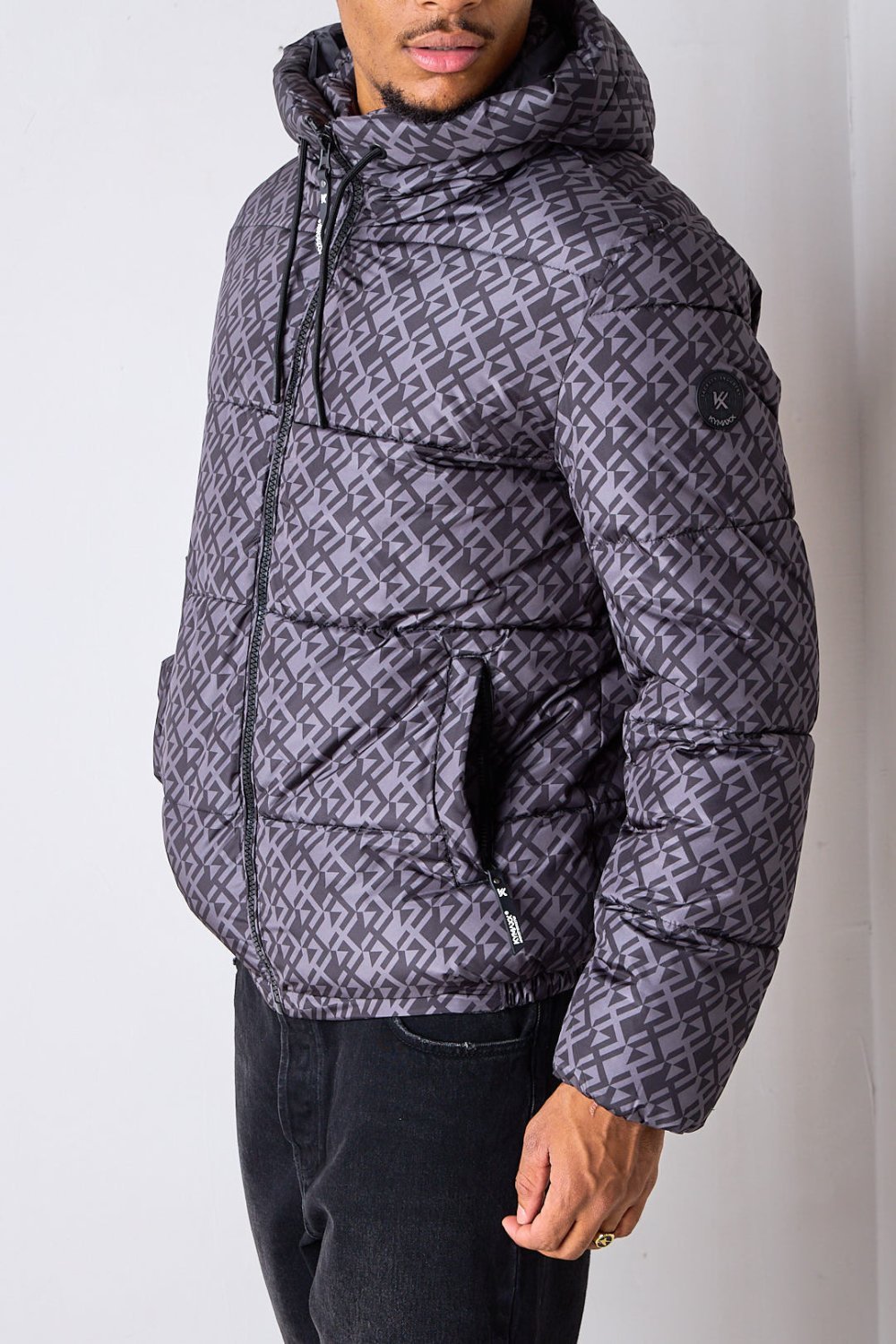 Black short puffer jacket with repeat pattern
