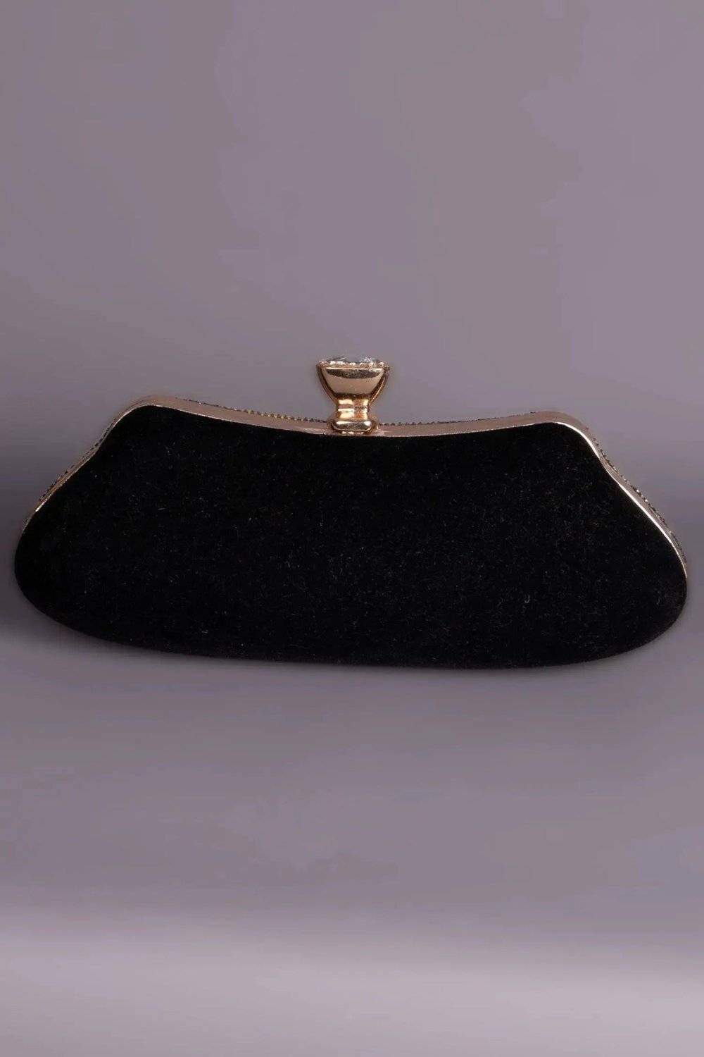 Minaudière noire pavée de strass à losanges