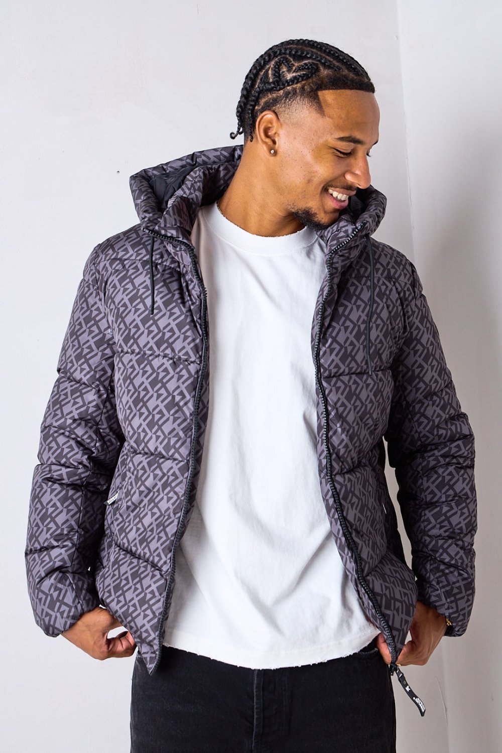 Black short puffer jacket with repeat pattern
