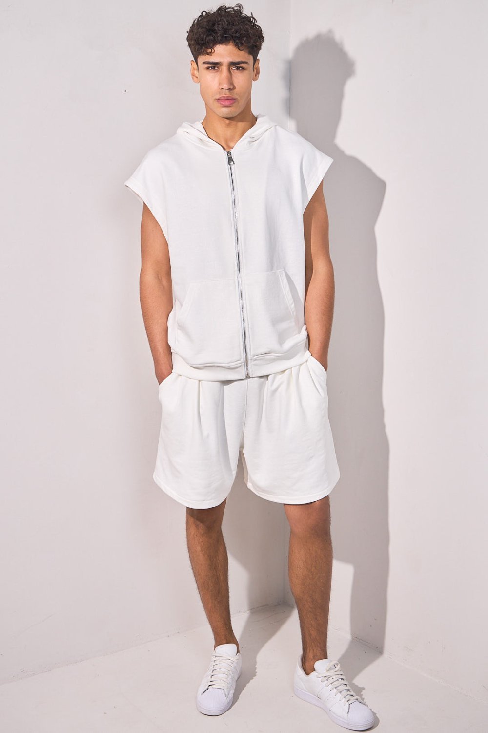 White sleeveless hooded jacket and shorts set