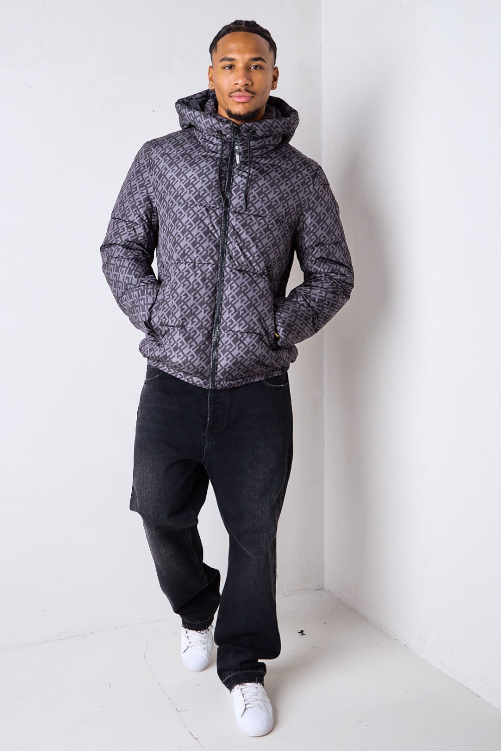 Black short puffer jacket with repeat pattern