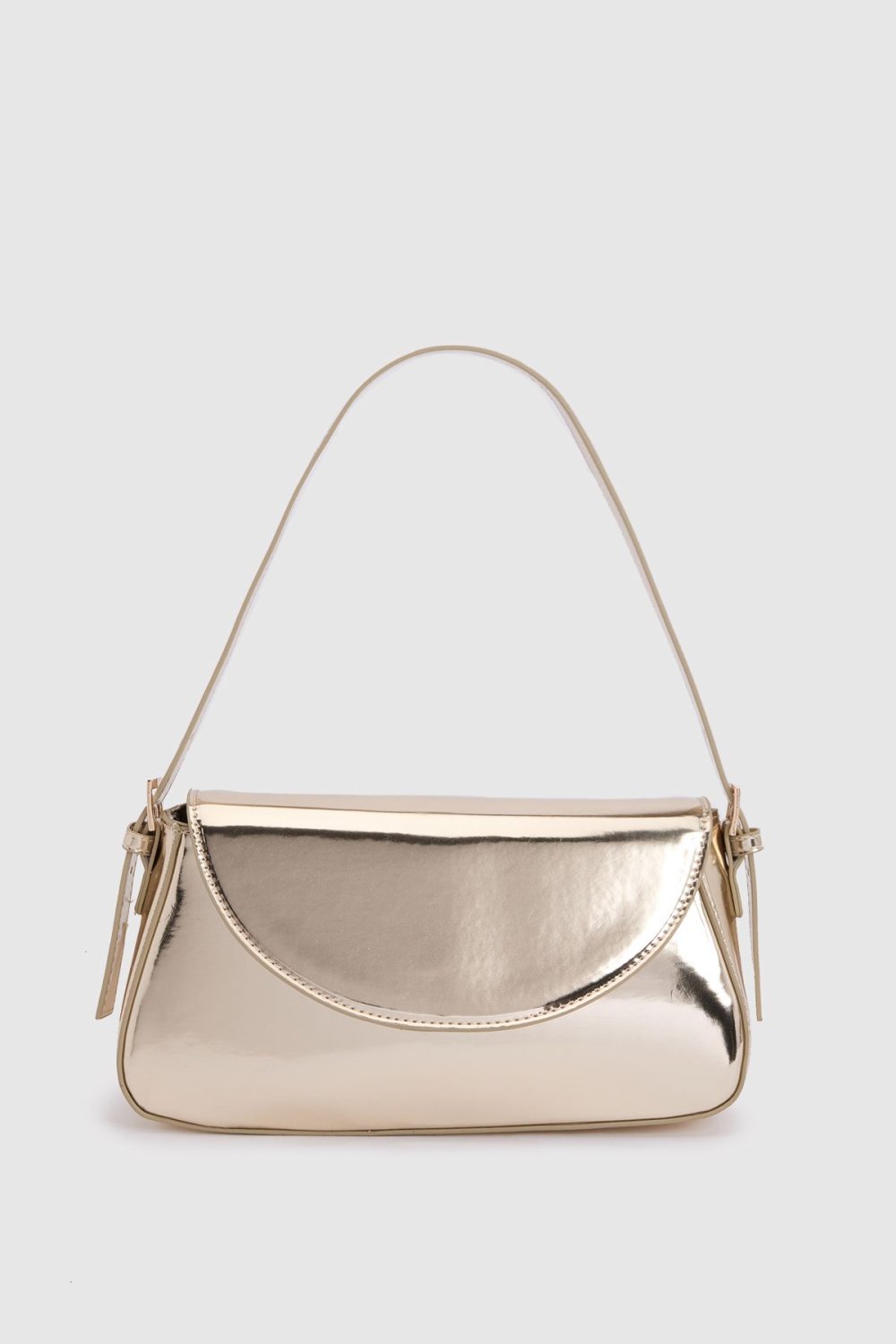 Patent shoulder bag with fold-over flap