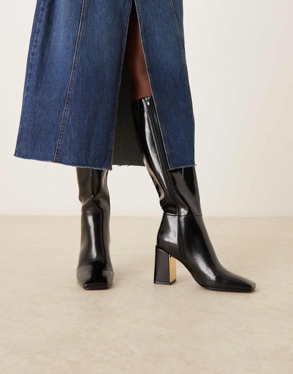 Bottes à talon avec plaque métallique noires