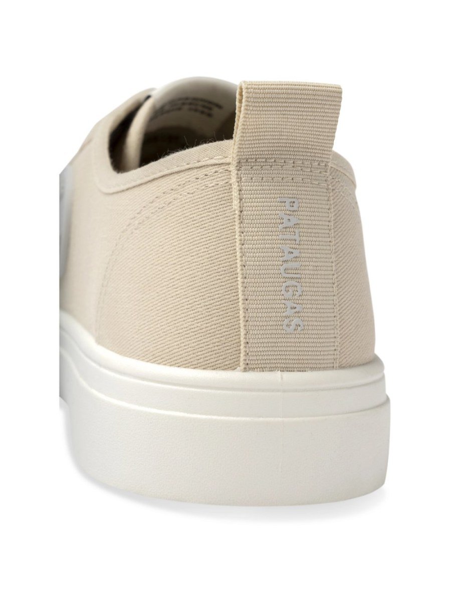 Beige canvas sneakers with rubber toe