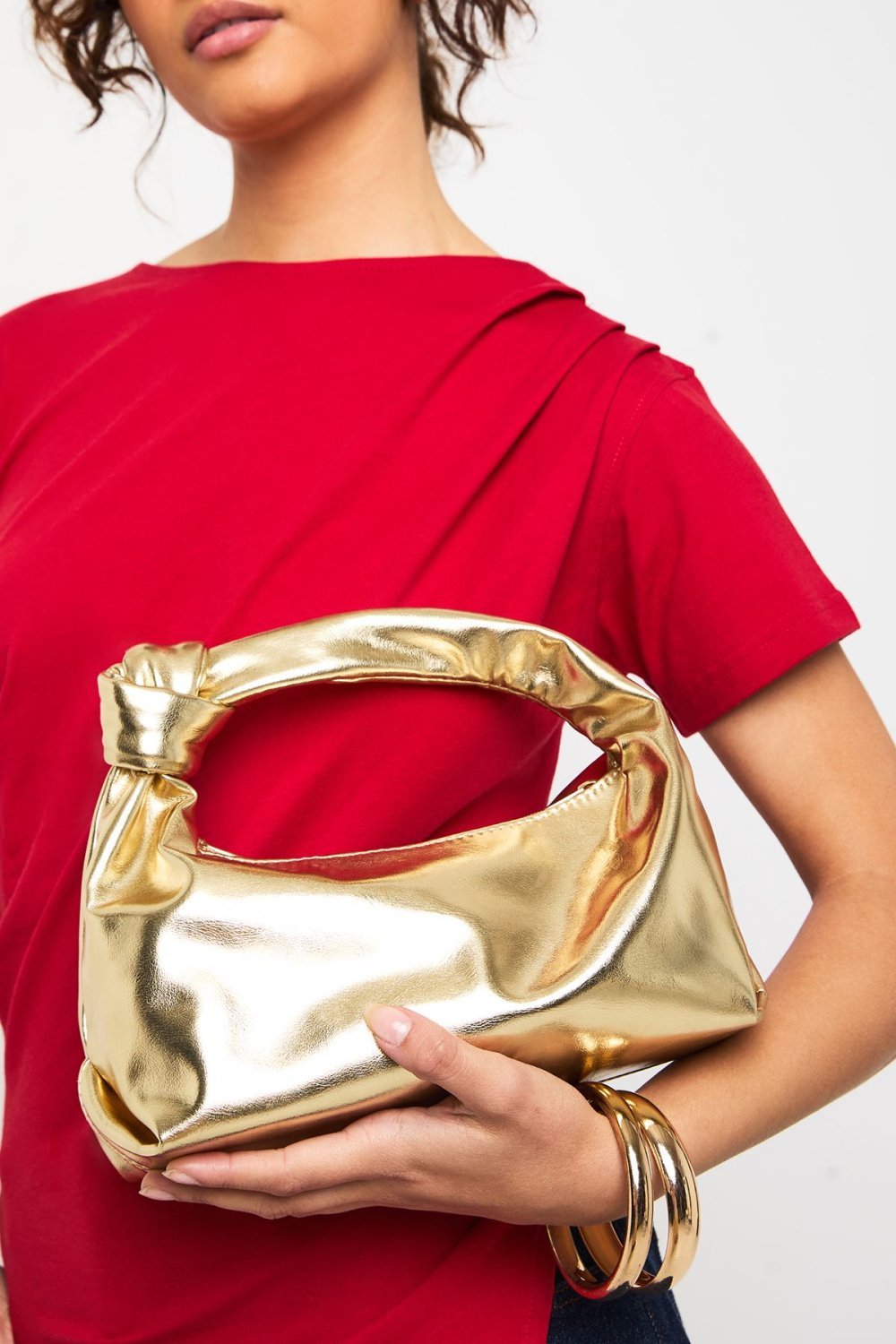 Gold grab bag with knot handle