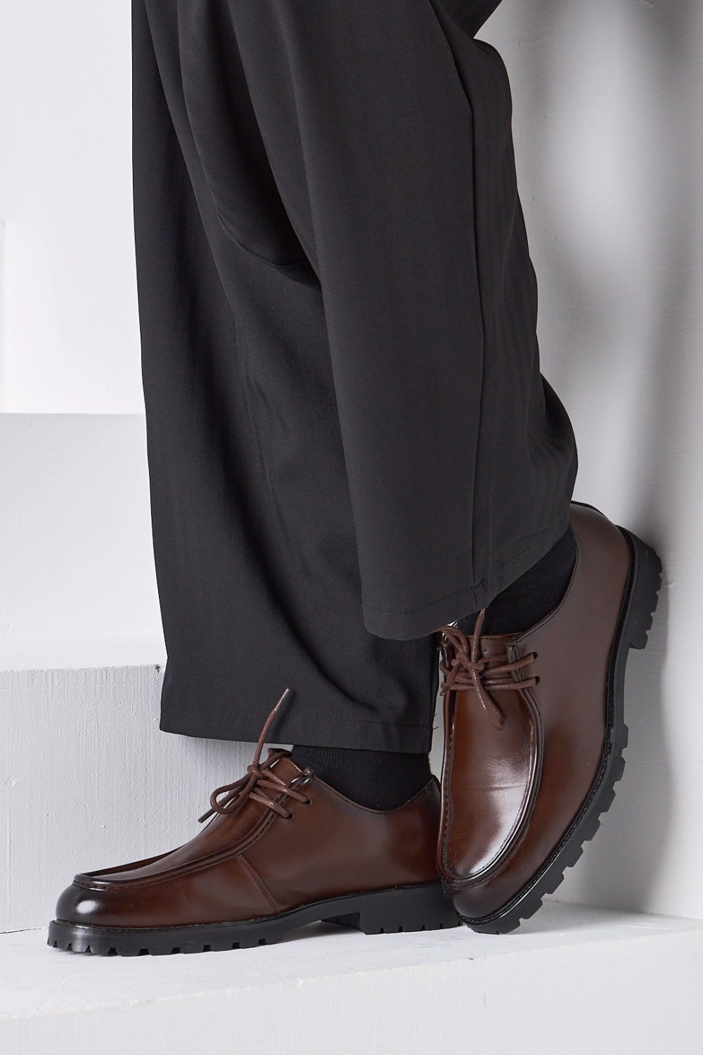 Brown lace-up shoes with chunky lug soles