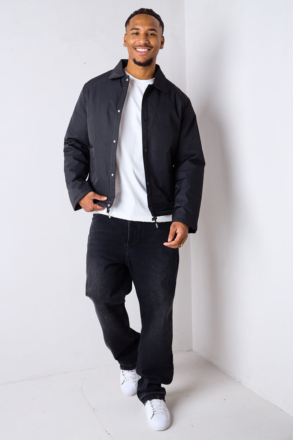 Black short button-up puffer with lapel collar