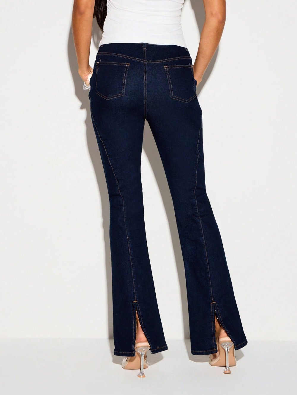 High-waisted flared jeans with split hem