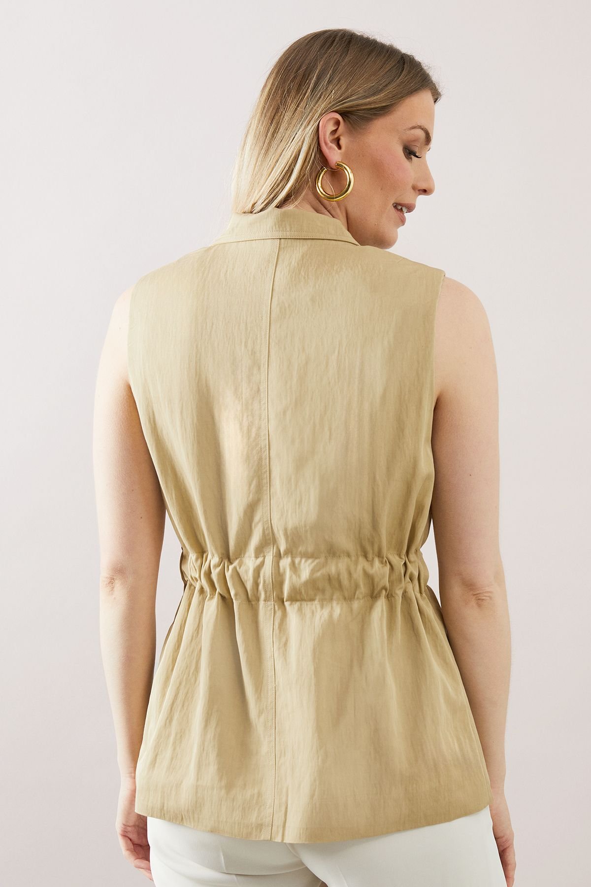 Belted sleeveless tailored waistcoat