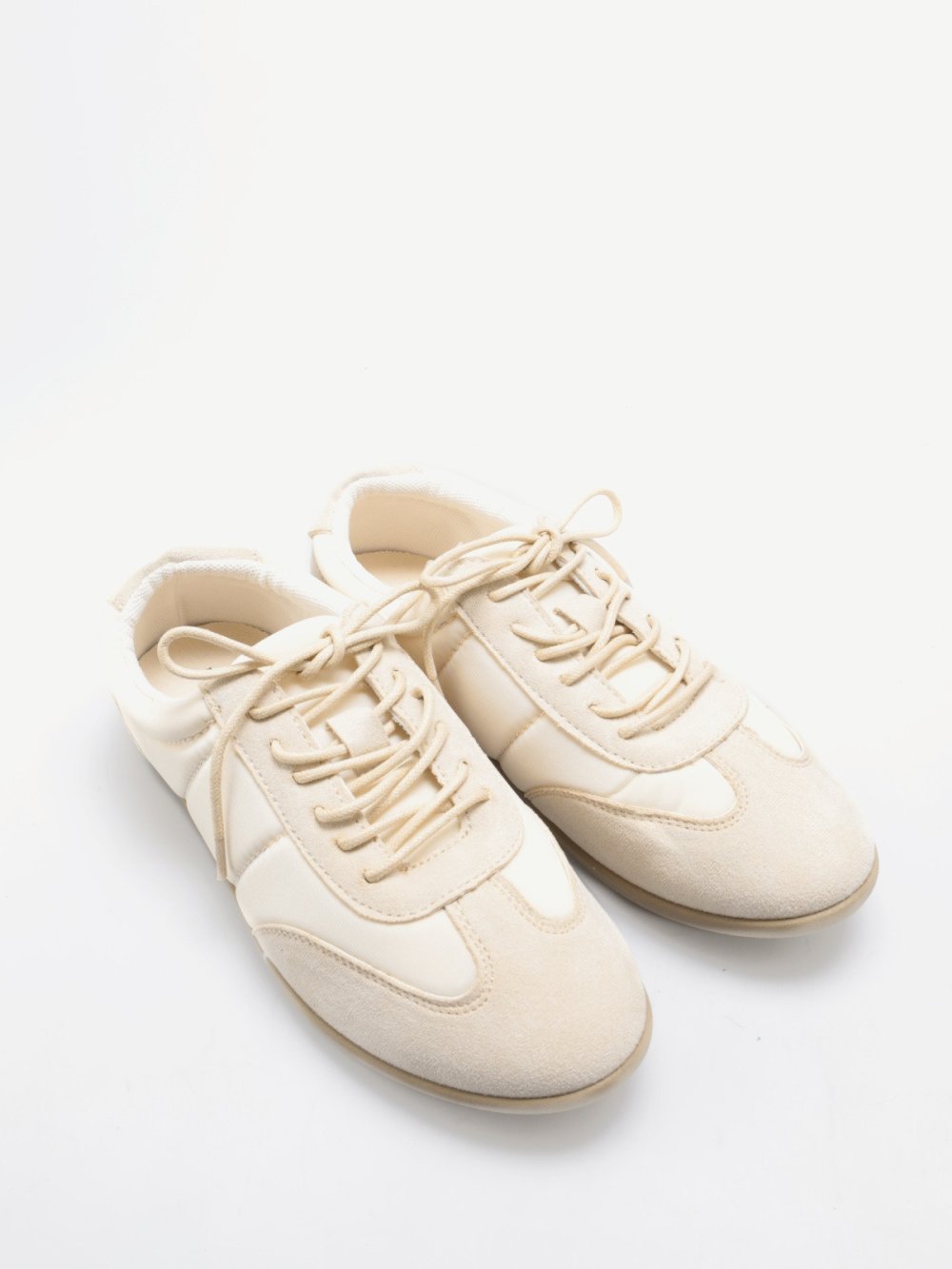 Beige quilted and faux suede trainers