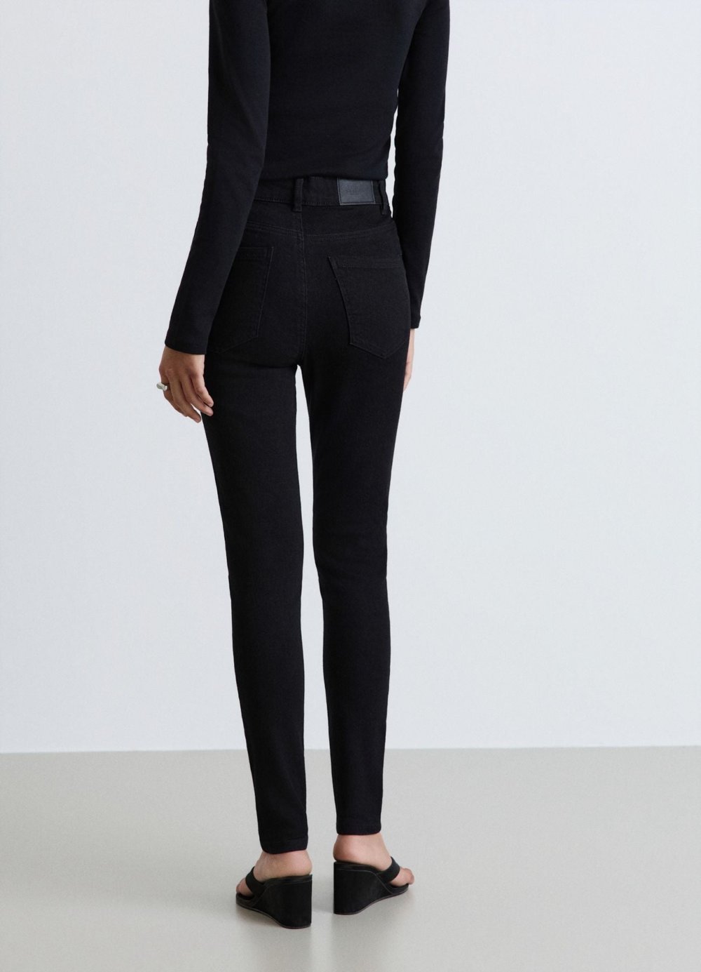 Black mid-rise skinny jeans