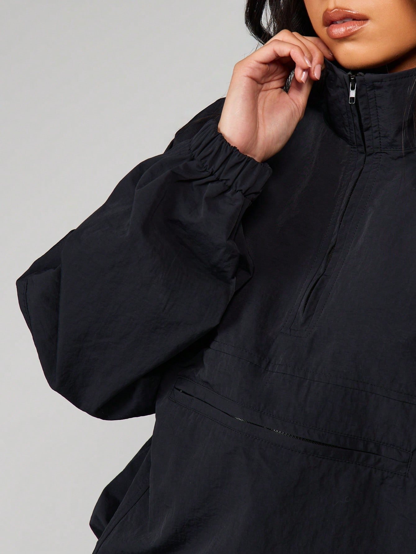 Veste coupe-vent col montant demi-zip