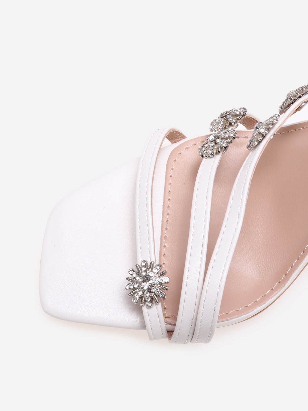 White spool heel sandals with star charms