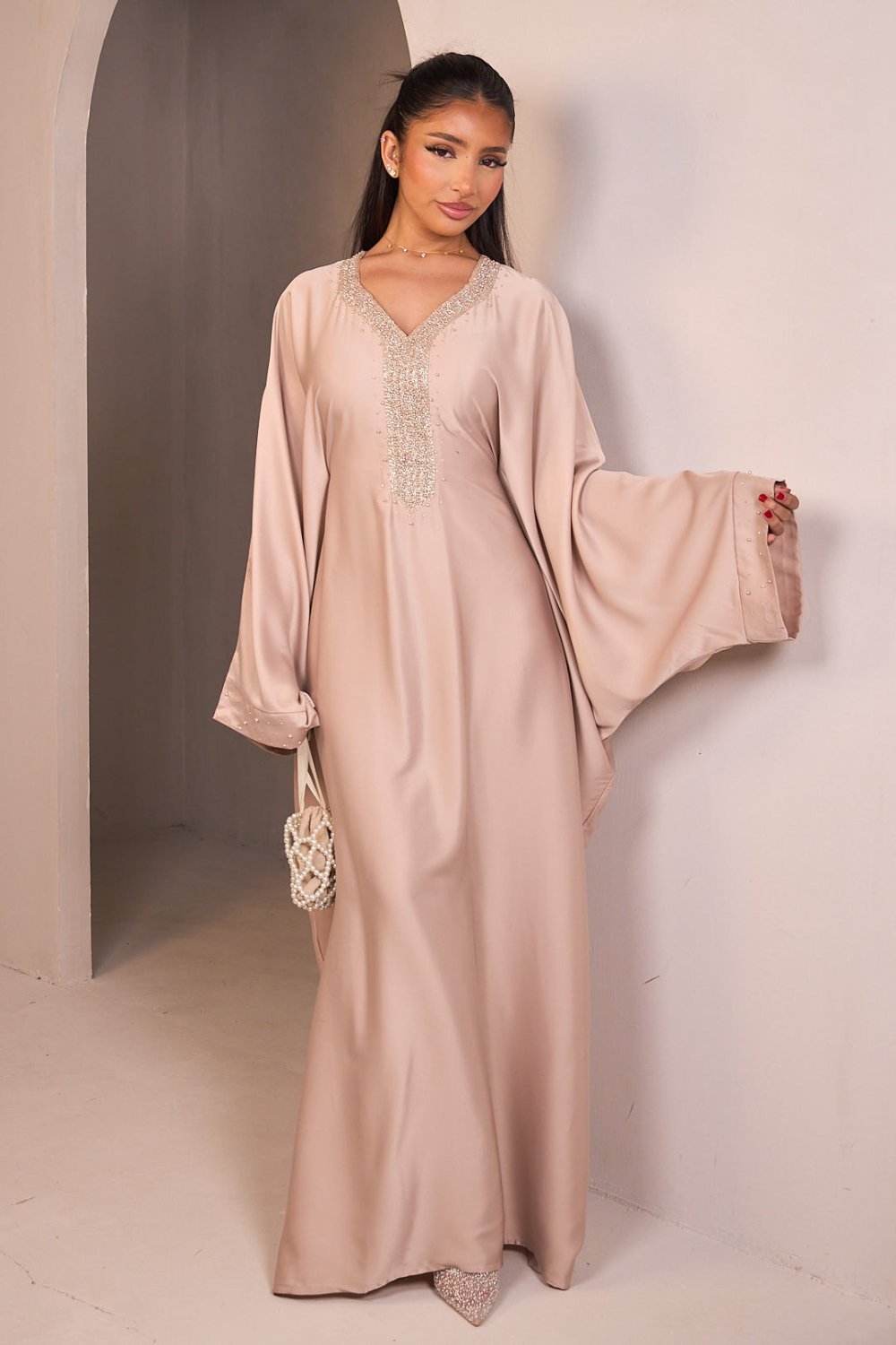 Beige satin abaya with beaded V-neck