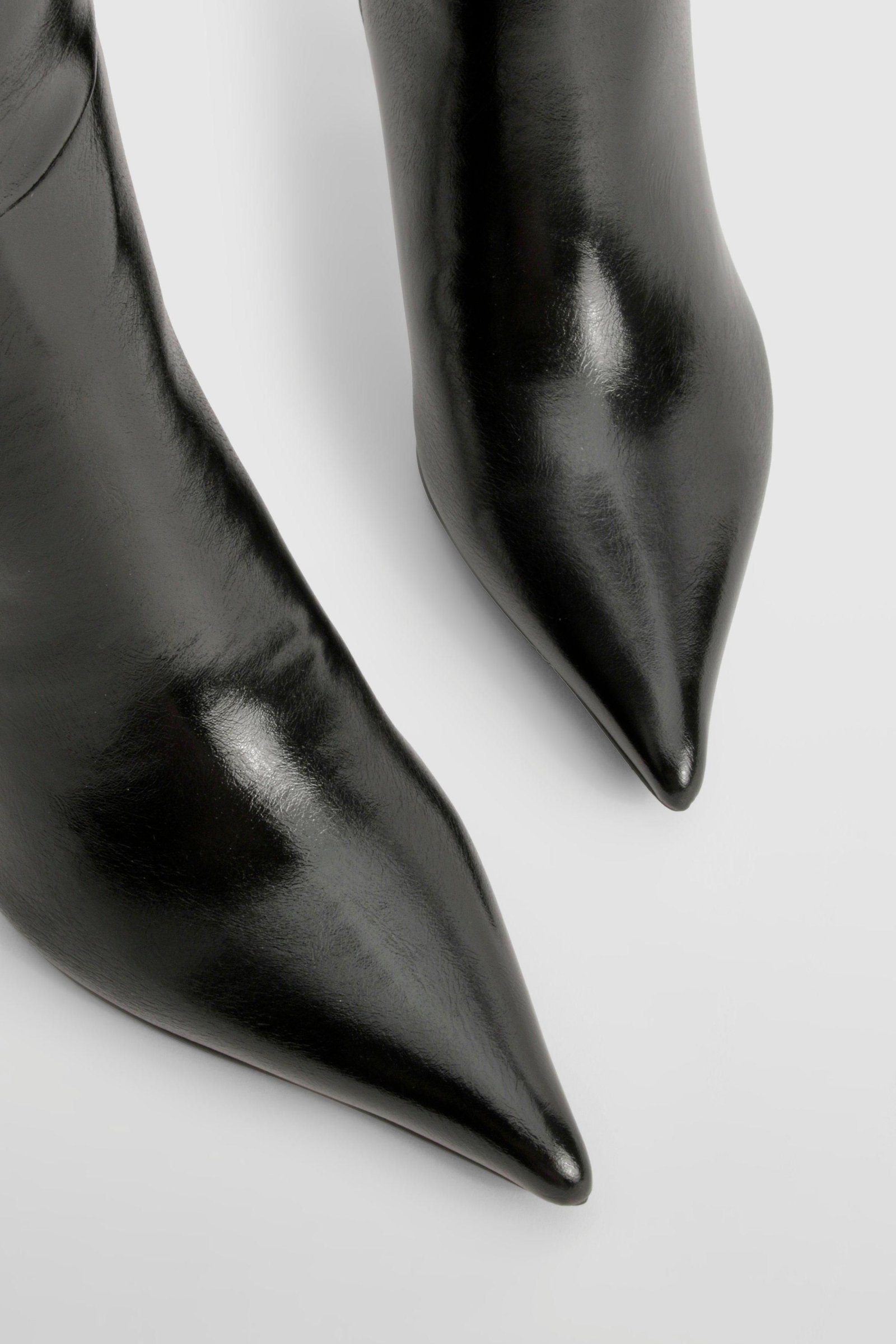 Bottes montantes stilettos à bout pointu