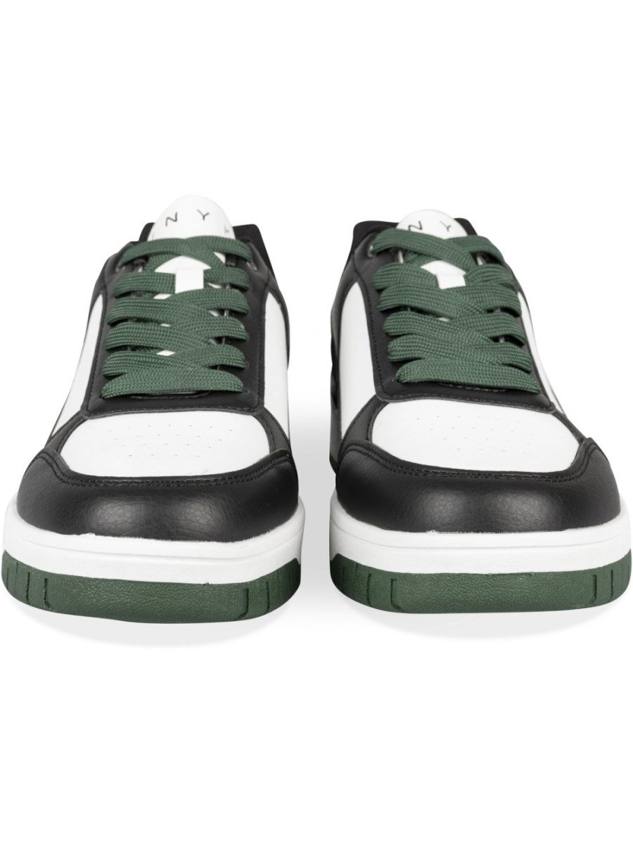White and black retro sneakers with green sole