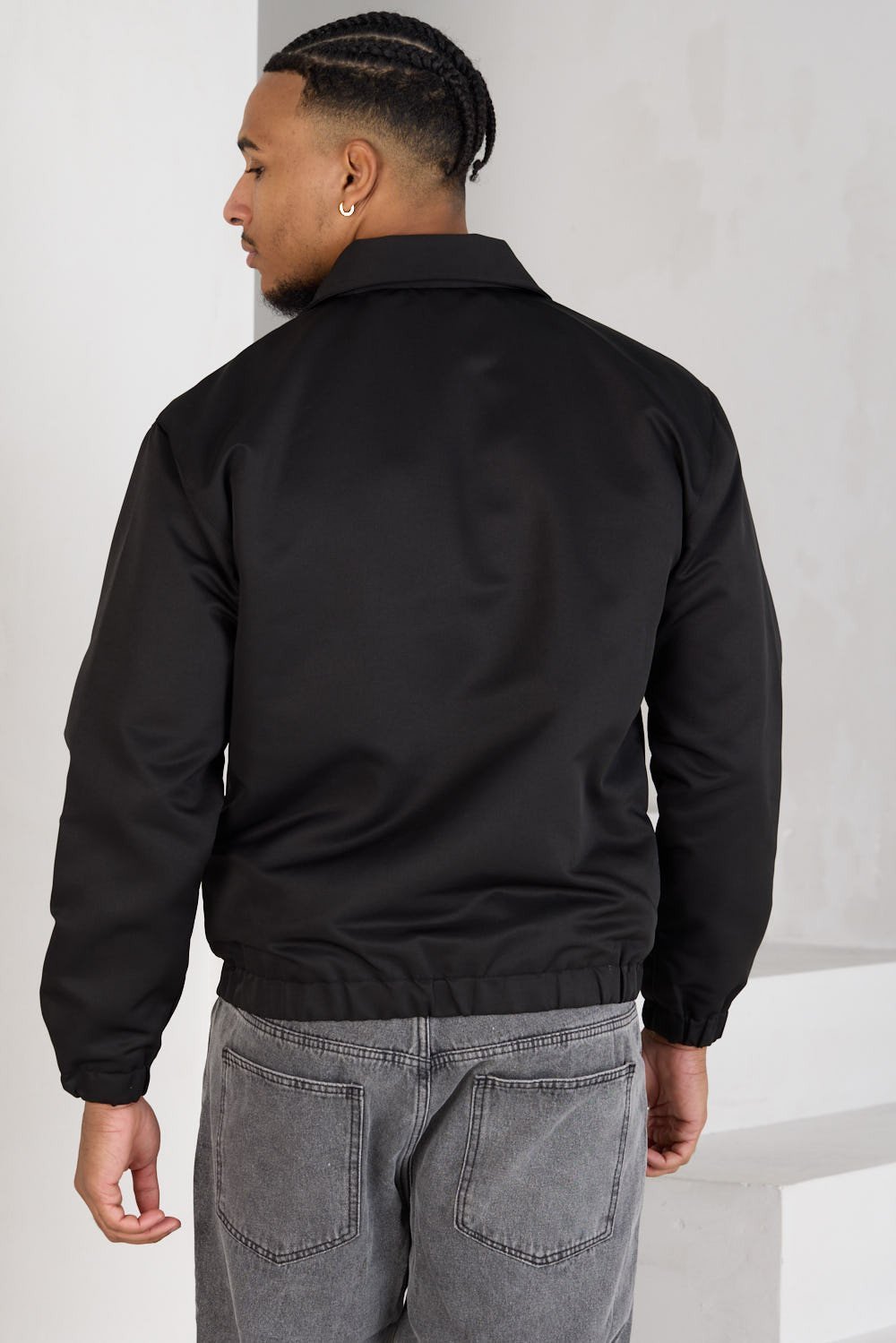 Black zip-up jacket with chest heart