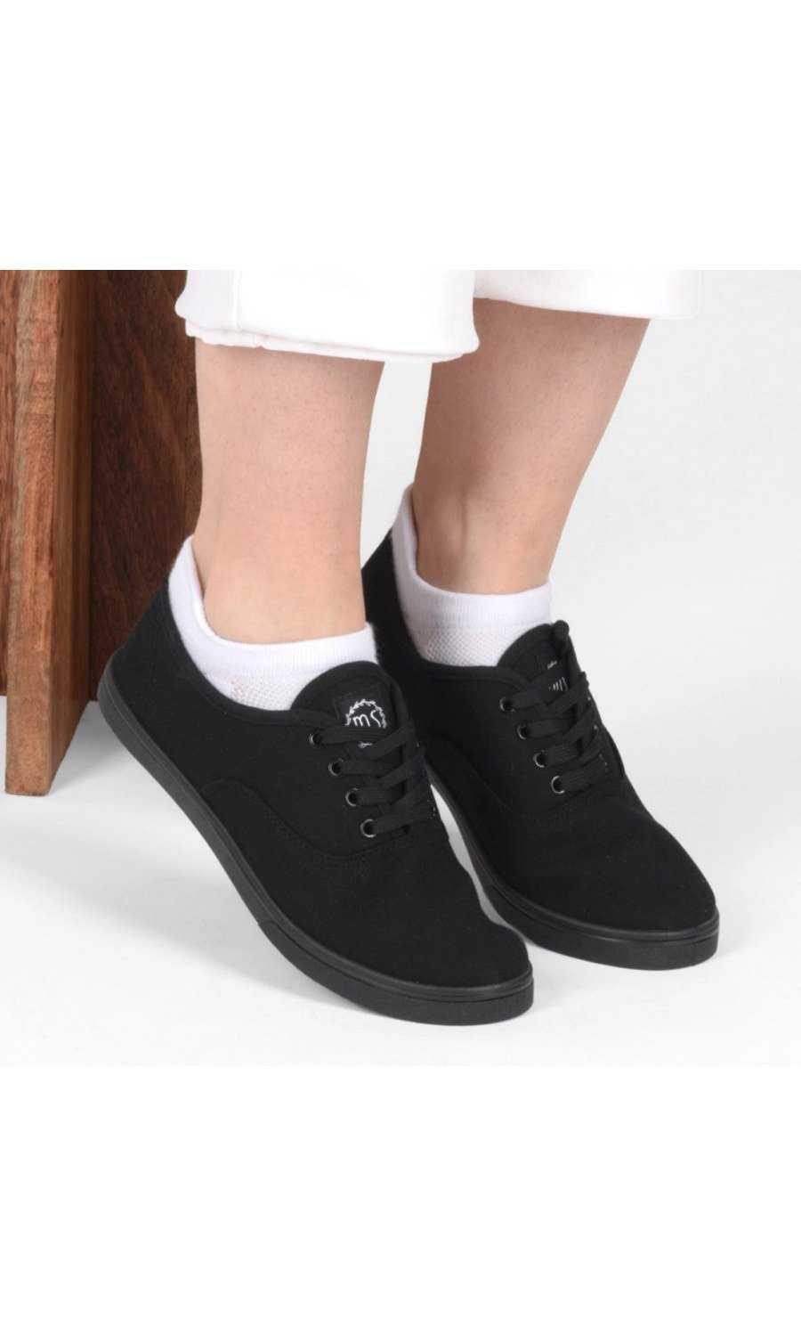 Black lace-up canvas plimsolls