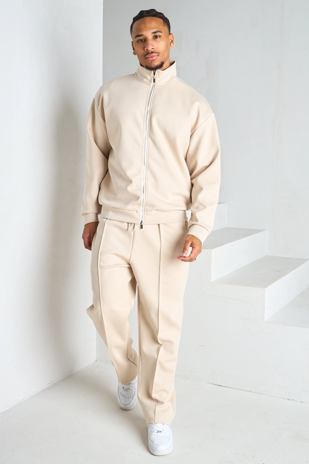 Beige zip jacket and pleated trousers set