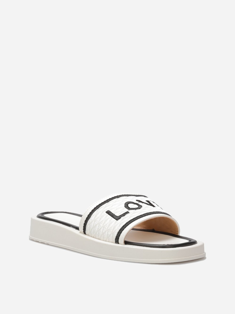 White platform mules with quilted strap