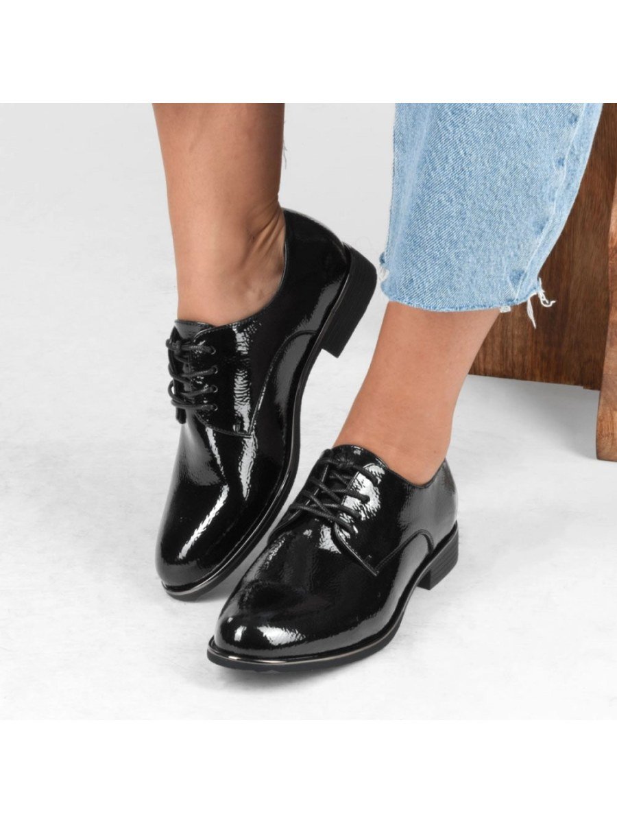 Black patent derbies with metallic trim